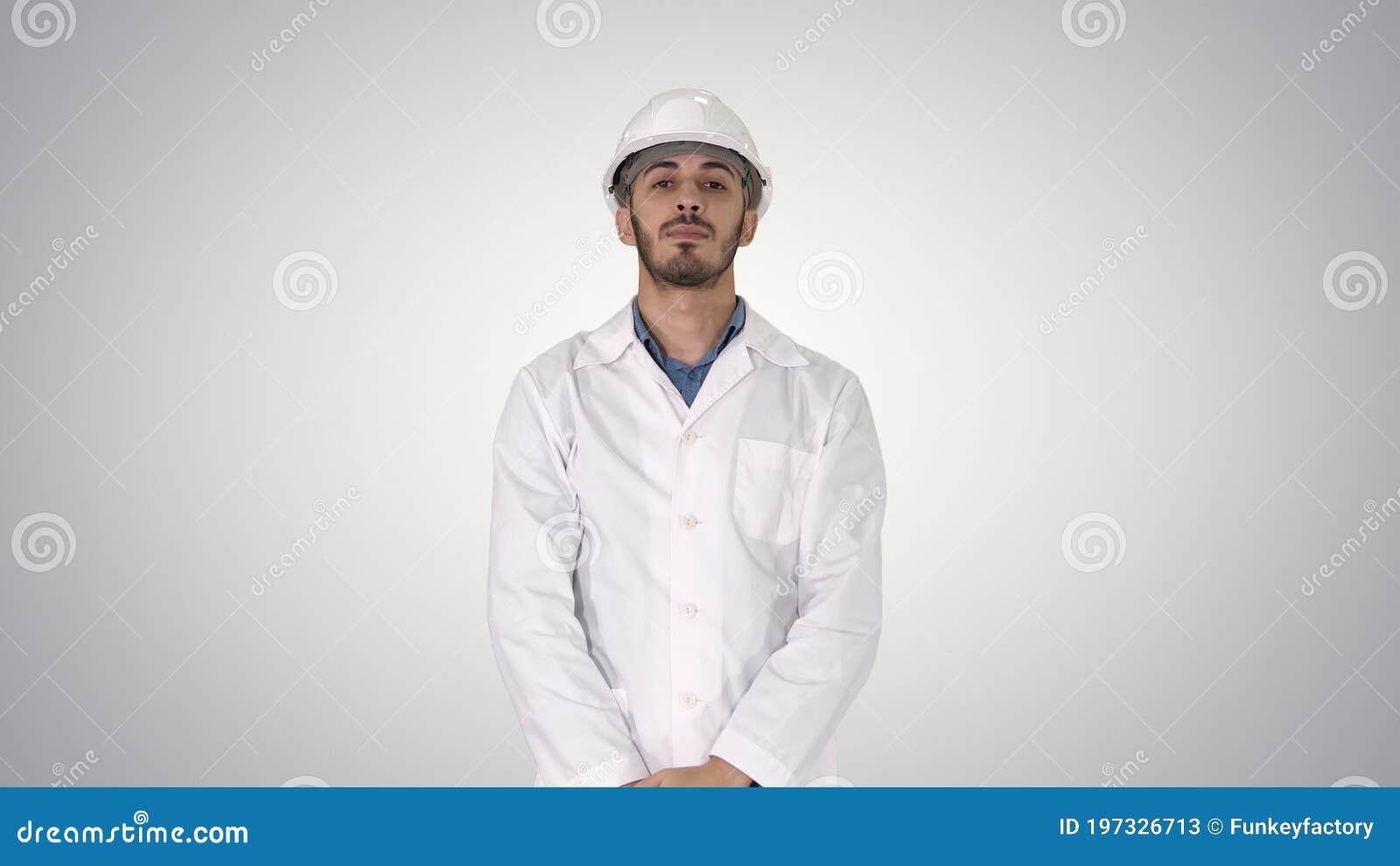 Arab Engineer in White Robe Putting Hard Hat on Safety Concept O Stock