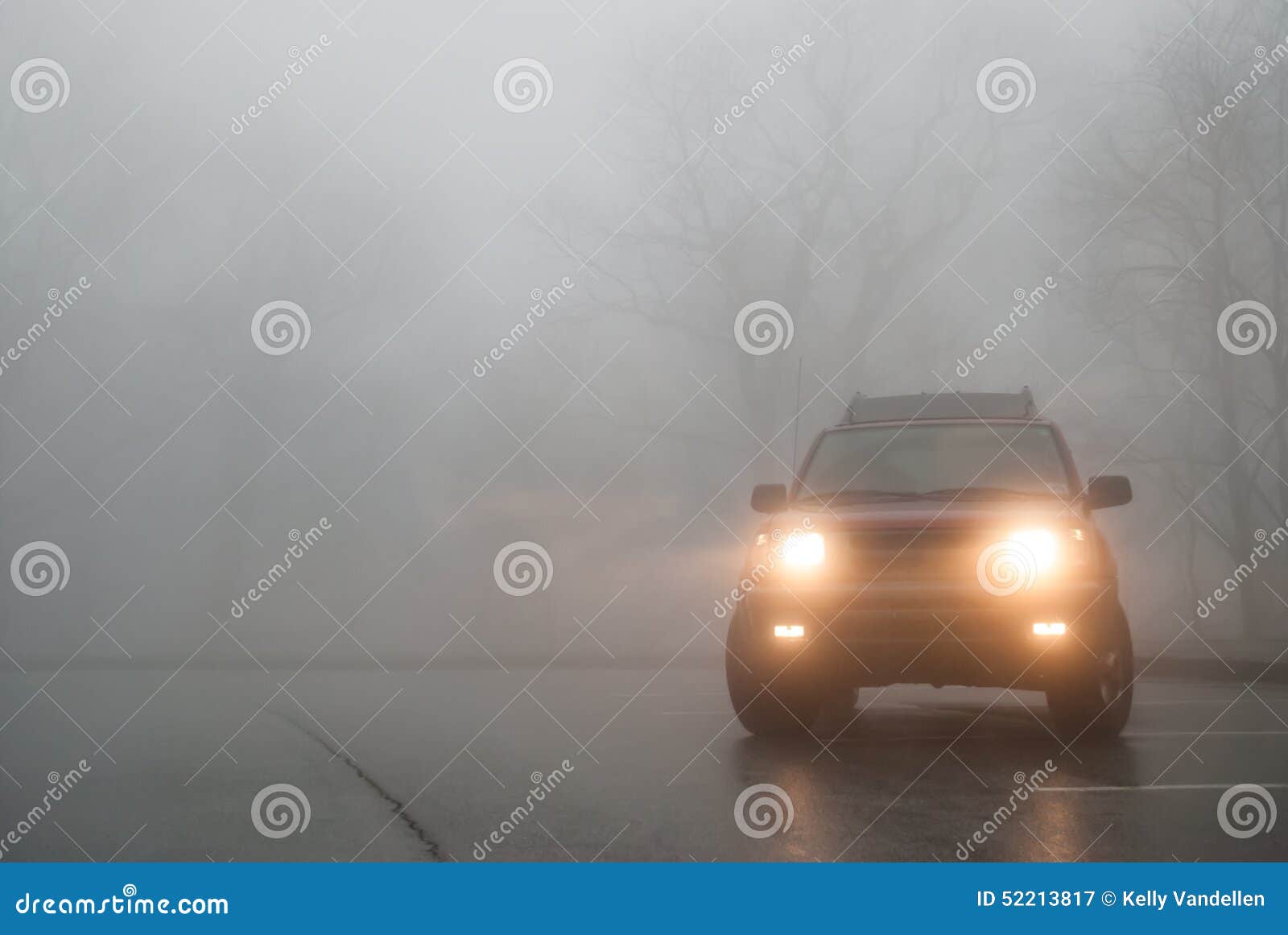 medium shot of suv lights in the fog