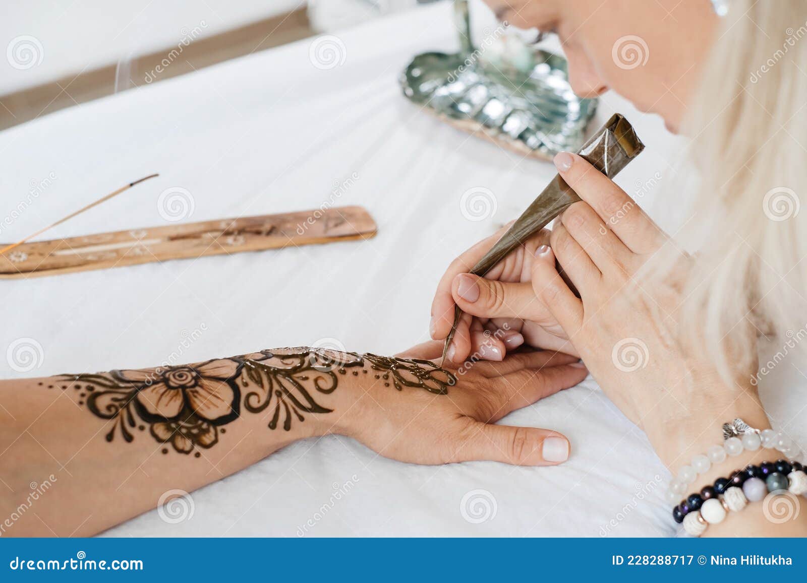 Female Hands with Mehendi Pattern of Flowers, Artist Painting with Henna Stock Image - Image of indian, person: 228288717 Female Hands with Mehendi Pattern of Flowers, Artist Painting with Henna Stock Image - Image of indian, person: 228288717