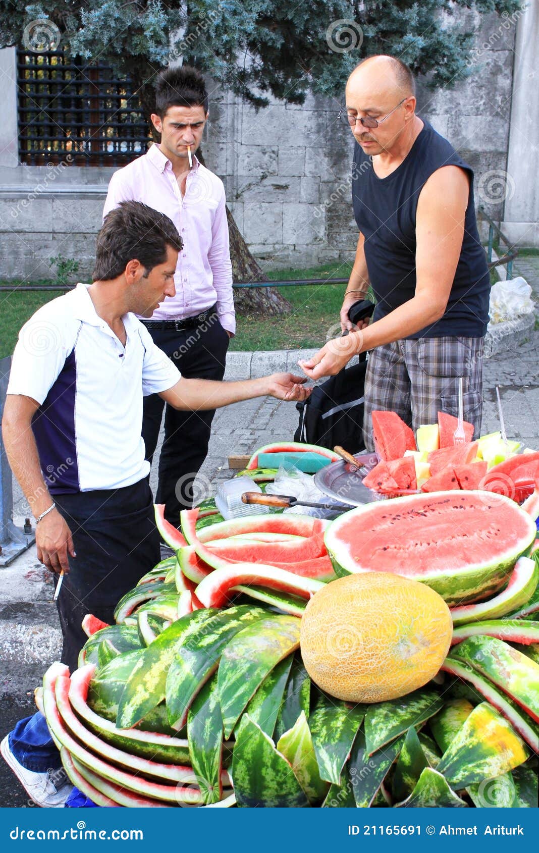 ISTANBUL,TURKEY-JUNE 7:Guys slicing watermelon to sell at their