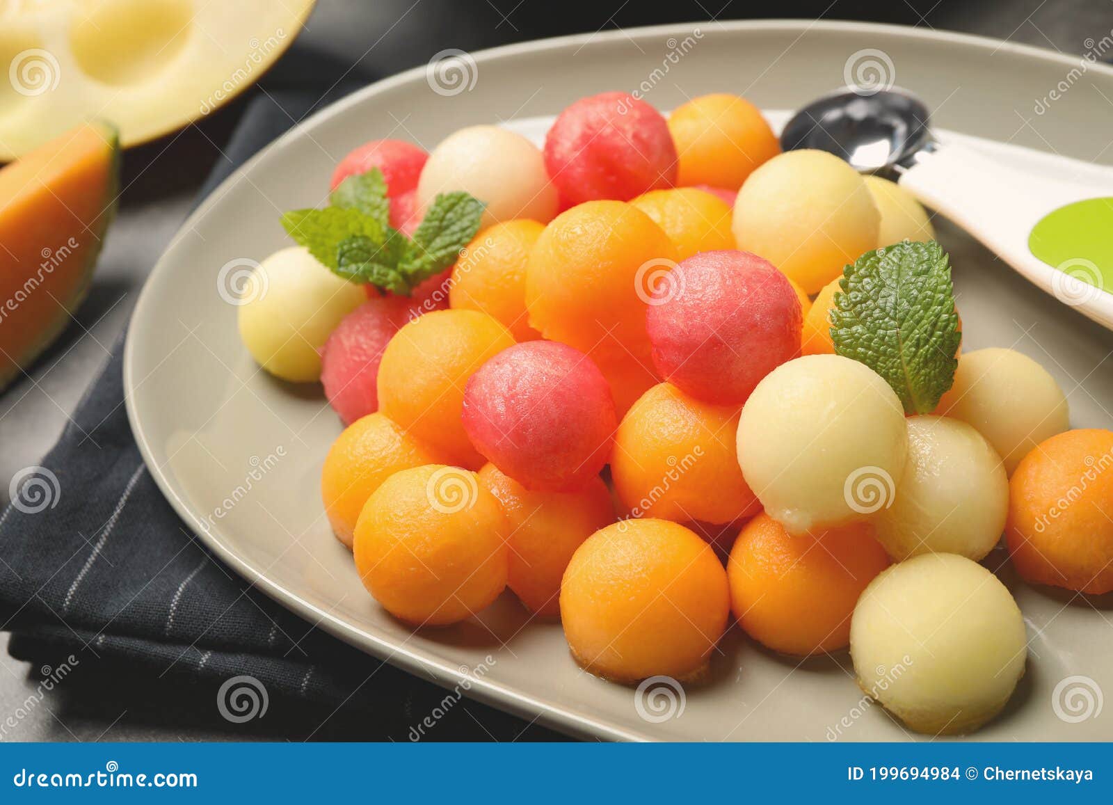 Melon and Watermelon Balls with Mint on Plate, Closeup Stock Photo