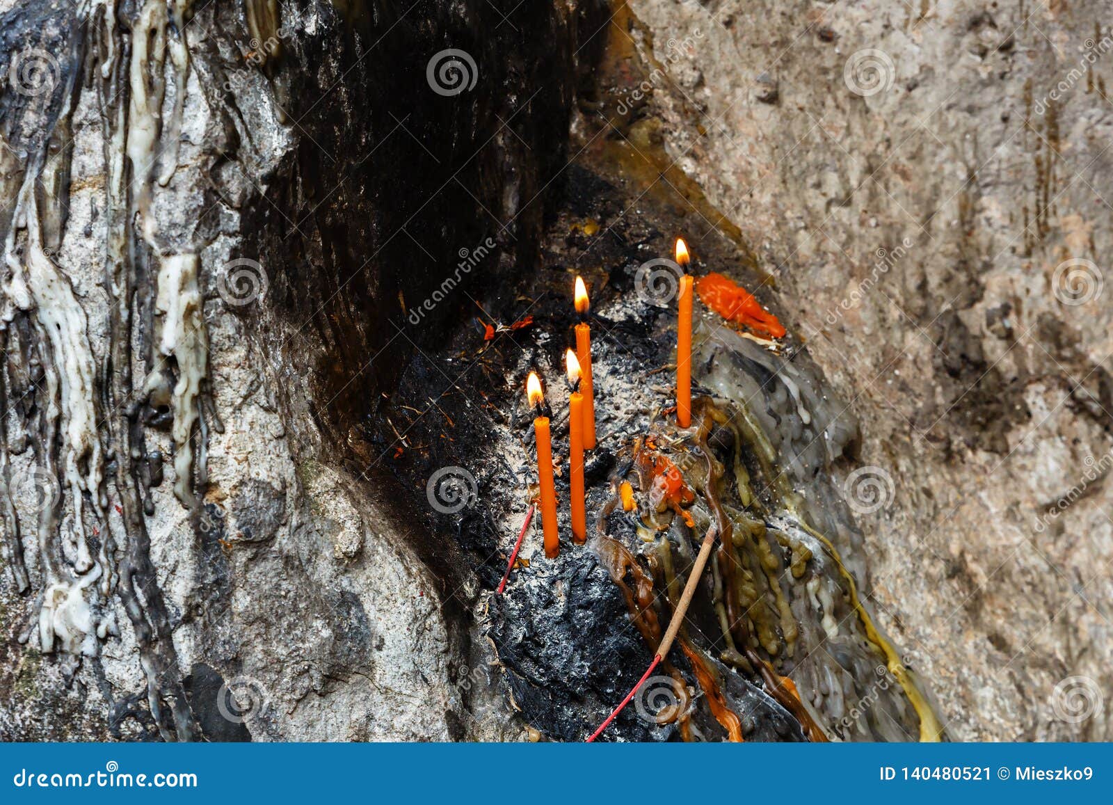 Melted candle on the stone stock image. Image of abstract 140480521