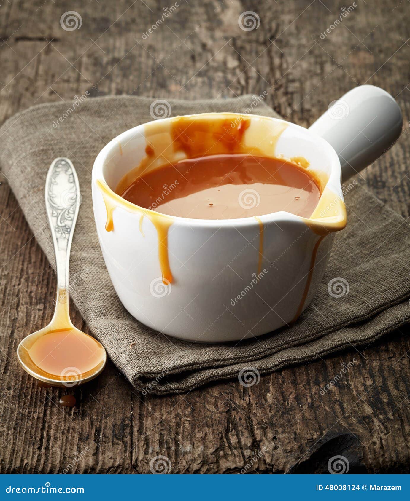 Melted caramel sauce stock photo. Image of brown, gold 48008124