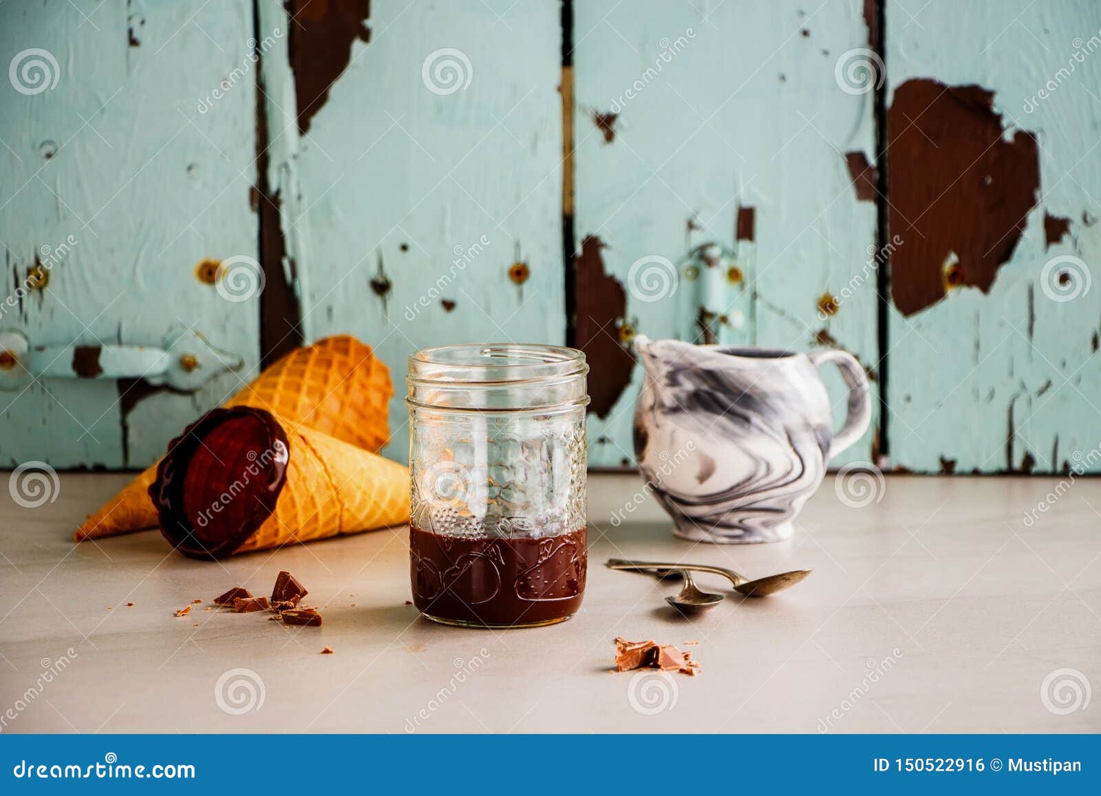 Melted chocolate in jar stock photo. Image of bright 150522916