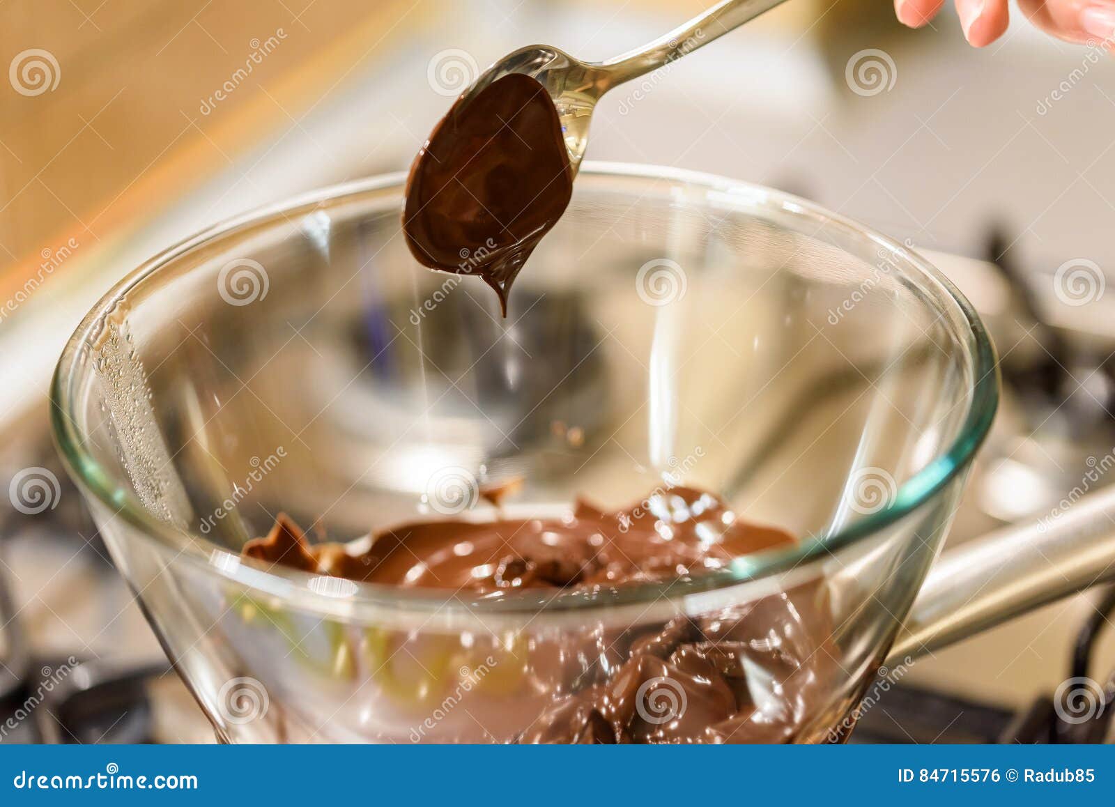 Melting Chocolate on Stove stock photo. Image of liquid 84715576