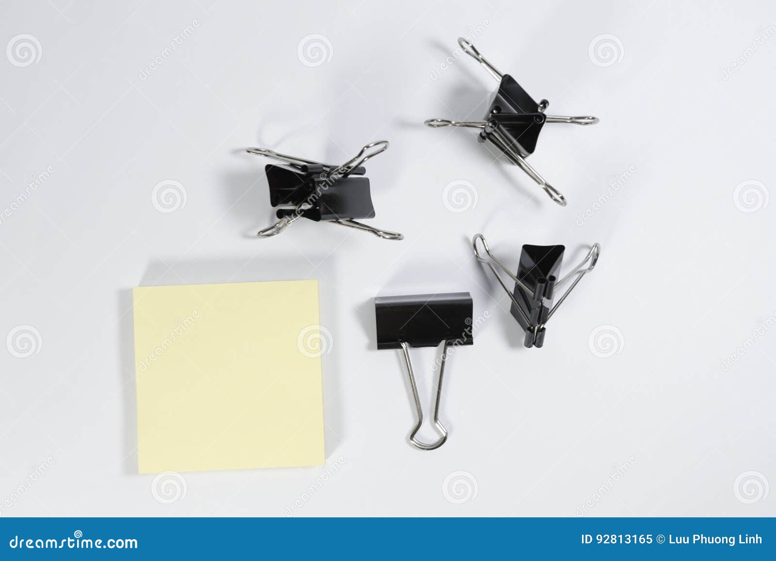 memopad and binder clips  on white background