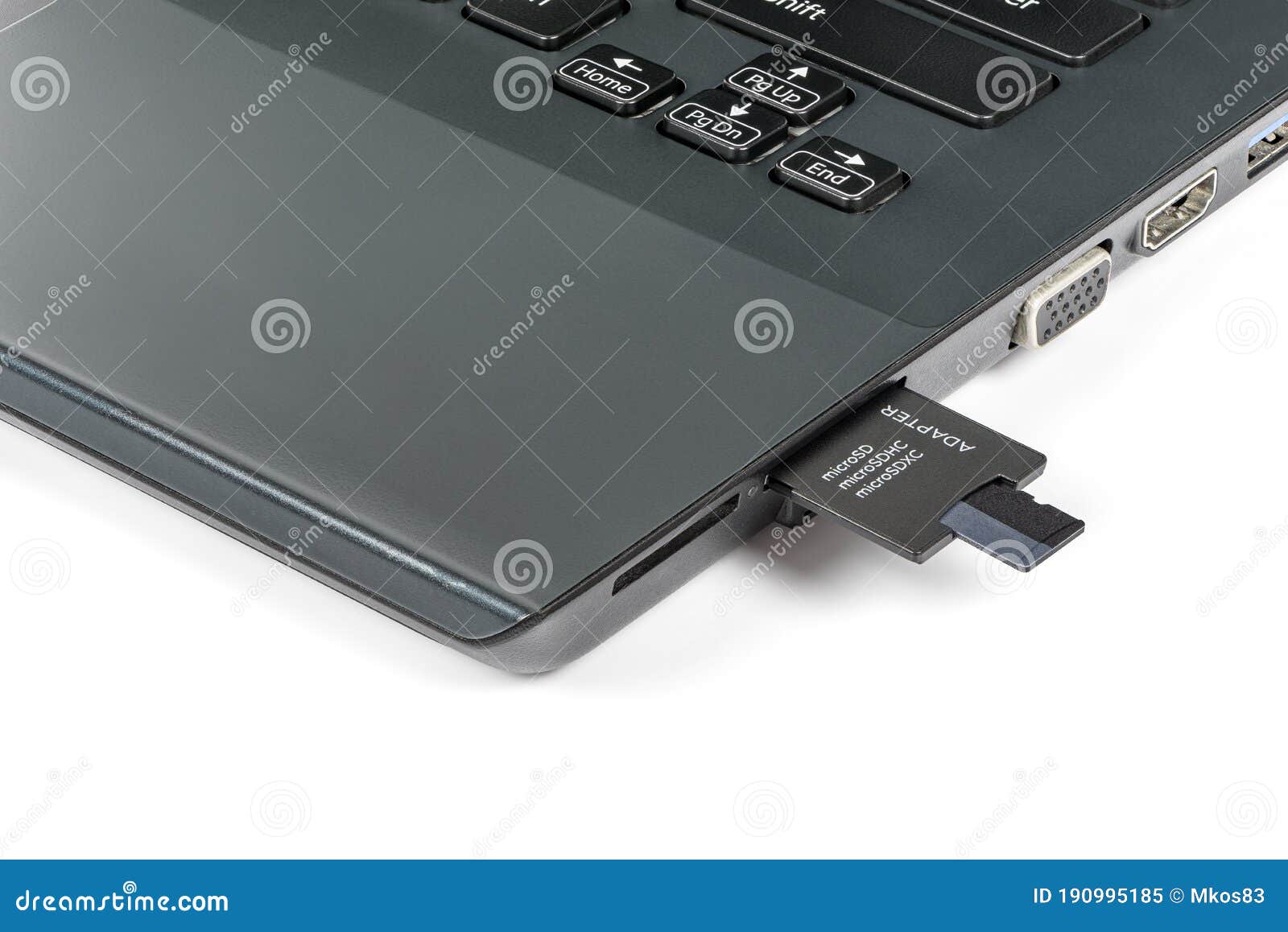 Memory Card Inserting into Adapter and Laptops Card Reader Stock Image