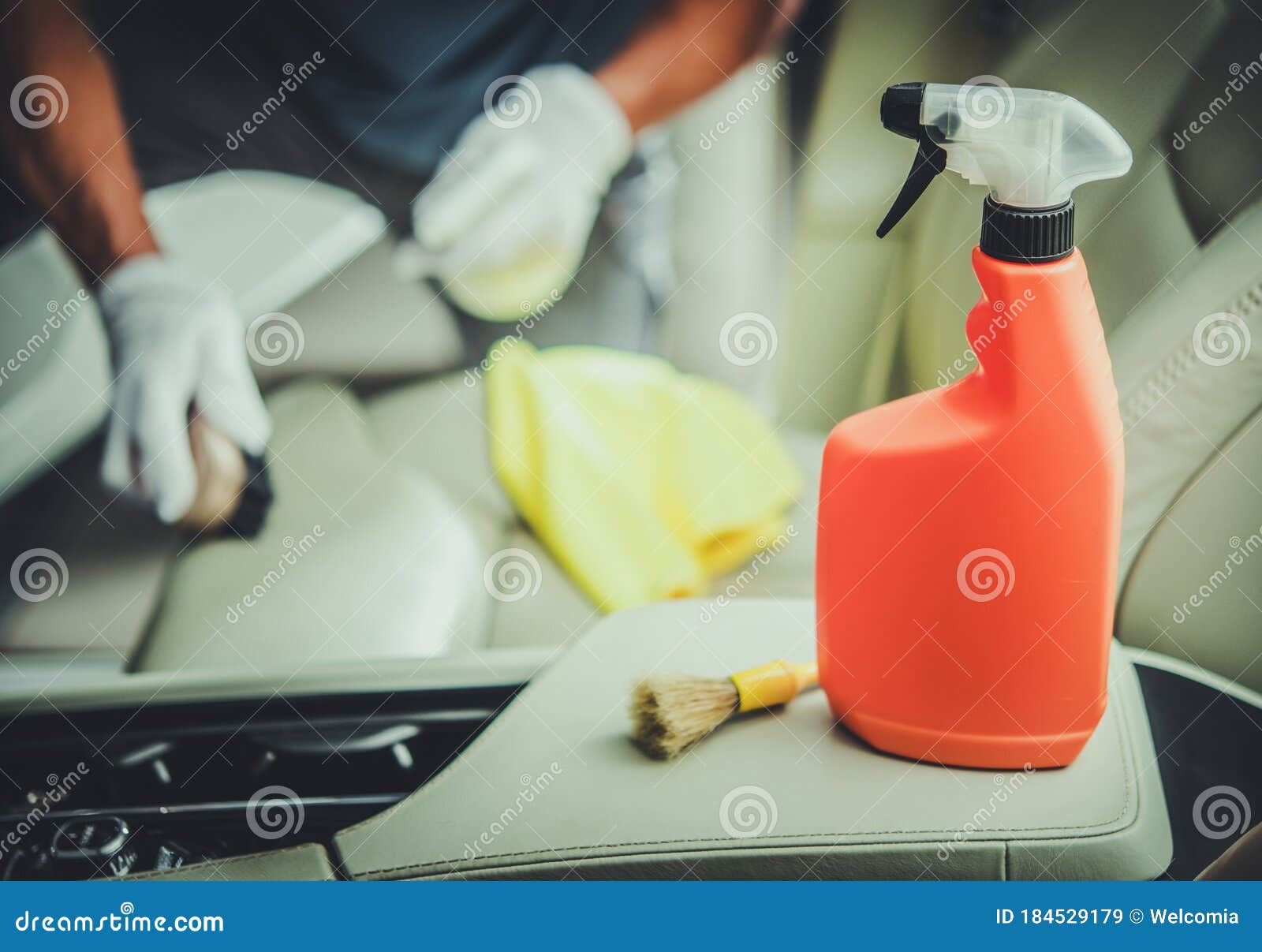 Men Cleaning Vehicle Interior Using Sanitizing Detergent Stock Image