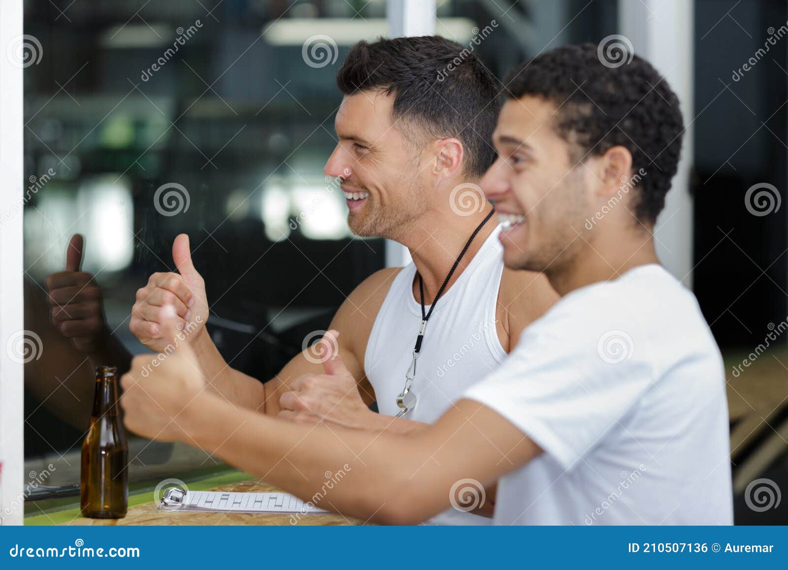 Men drinking beer in gym stock photo. Image of exited 210507136