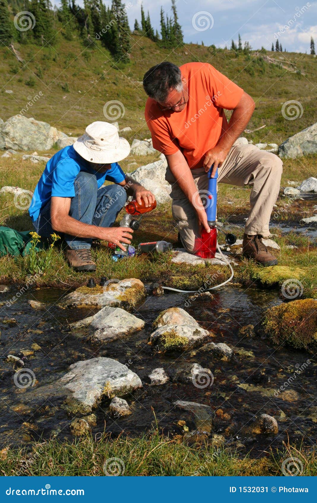 Men Filtering Water from Mountain Stream 4 Stock Image Image of