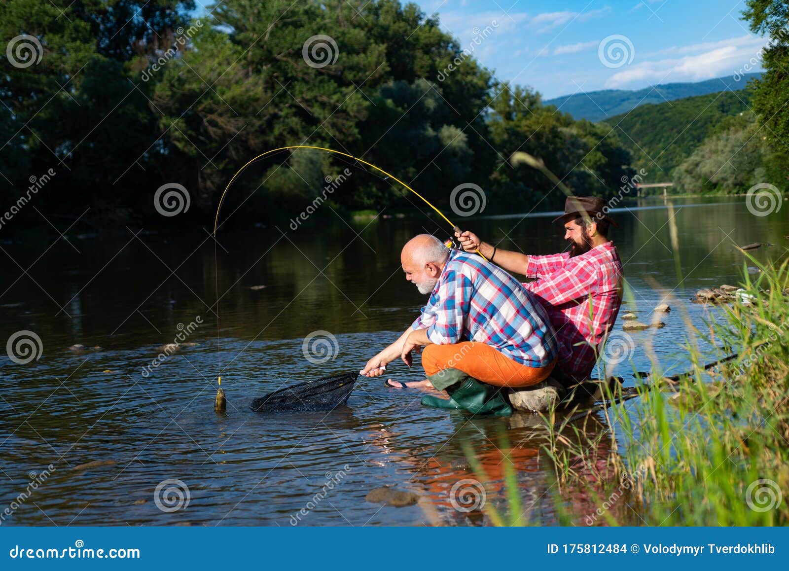 Men Fishing Relaxing while Enjoying Hobby. Fishing Freshwater Lake