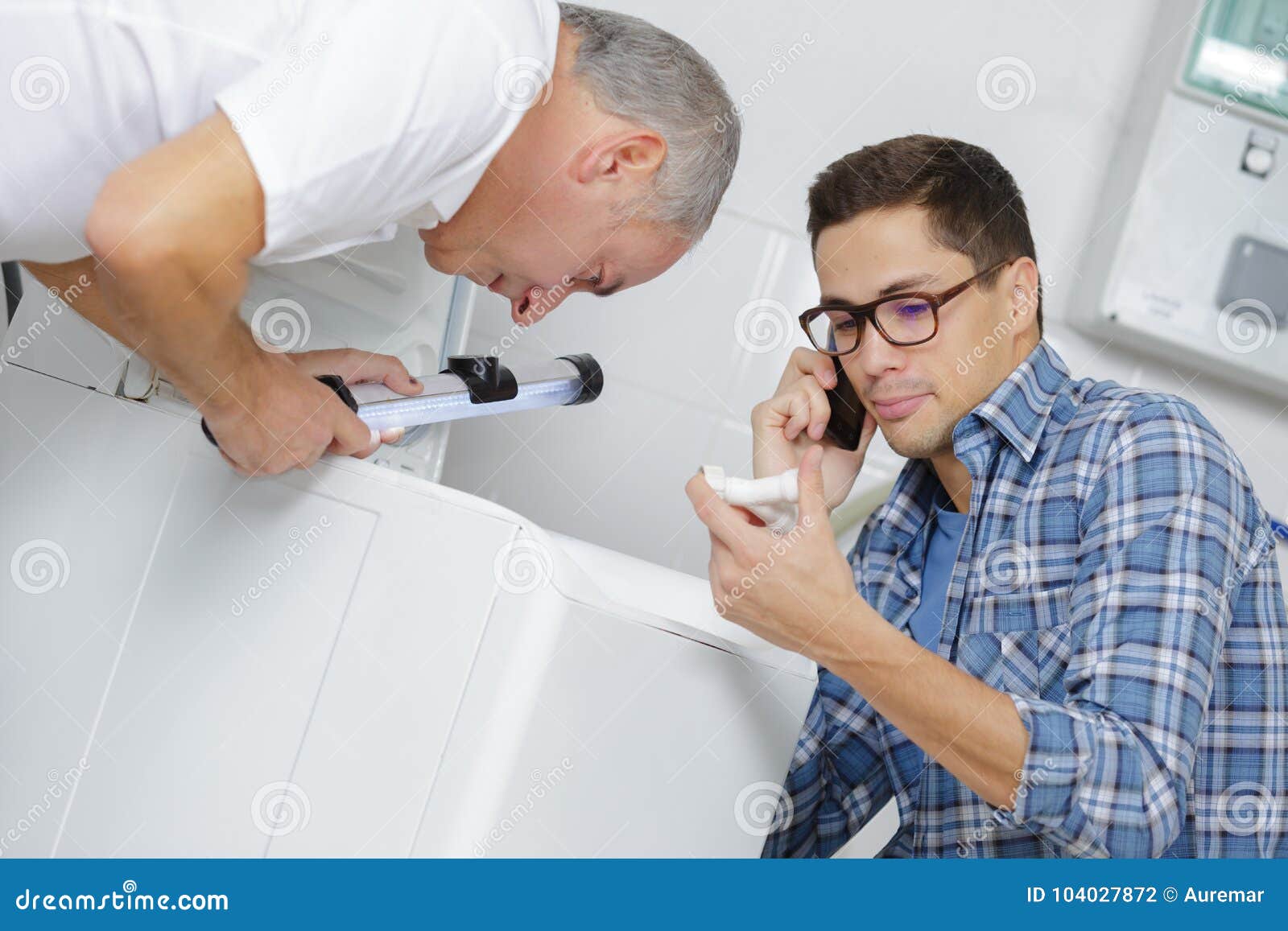 Men Fitting Washing Machine Stock Photo Image of room, repair 104027872