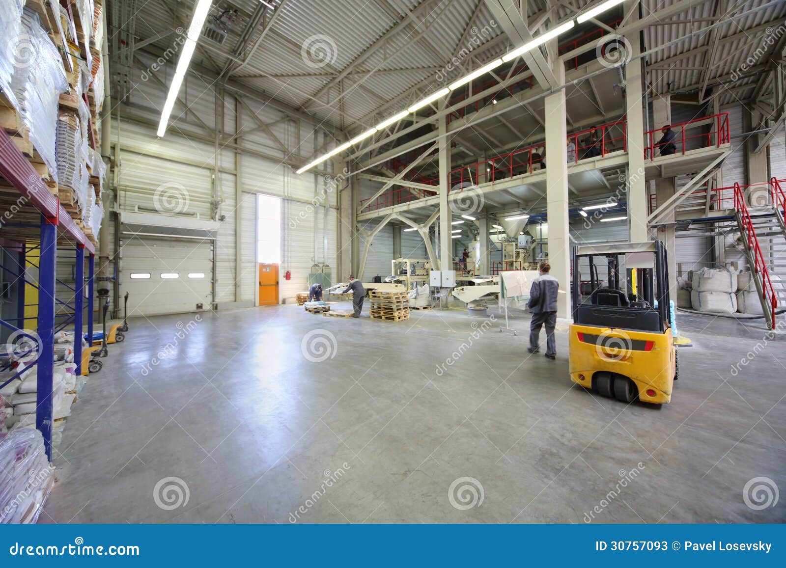 Men in Gray Uniform Work in Large Warehouse Editorial Stock Photo