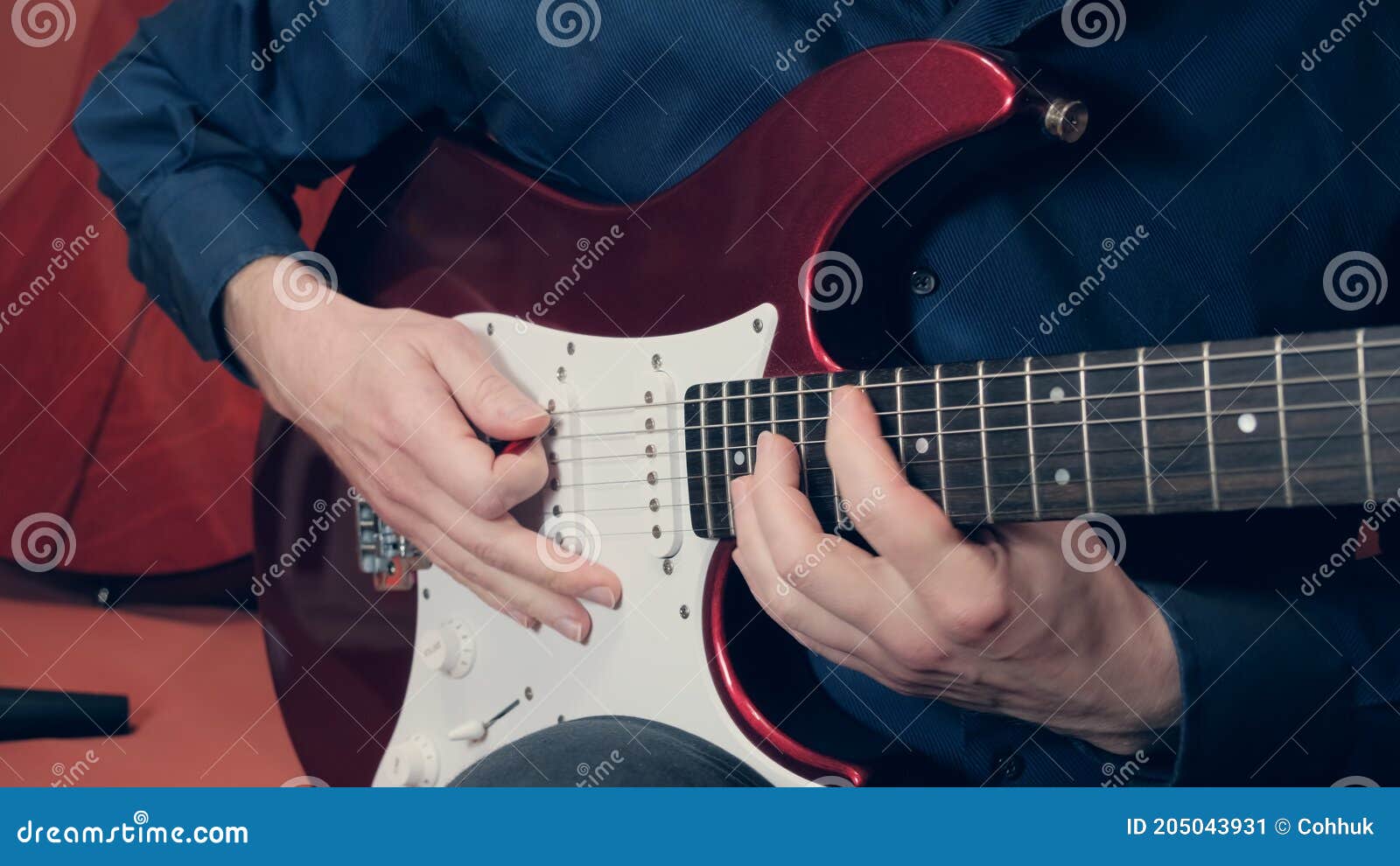 men hands play the electric guitar