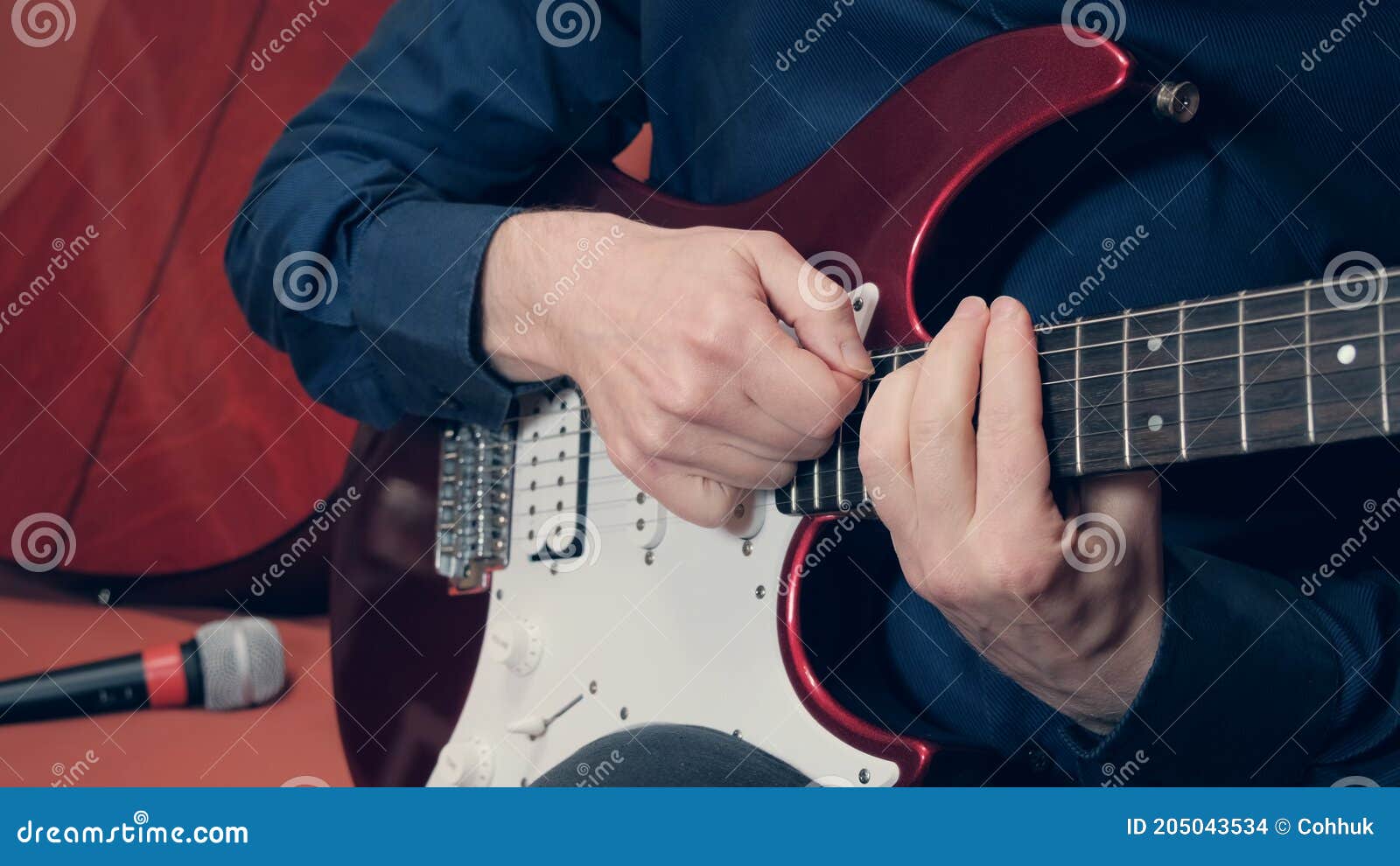 men hands play purple electric guitar
