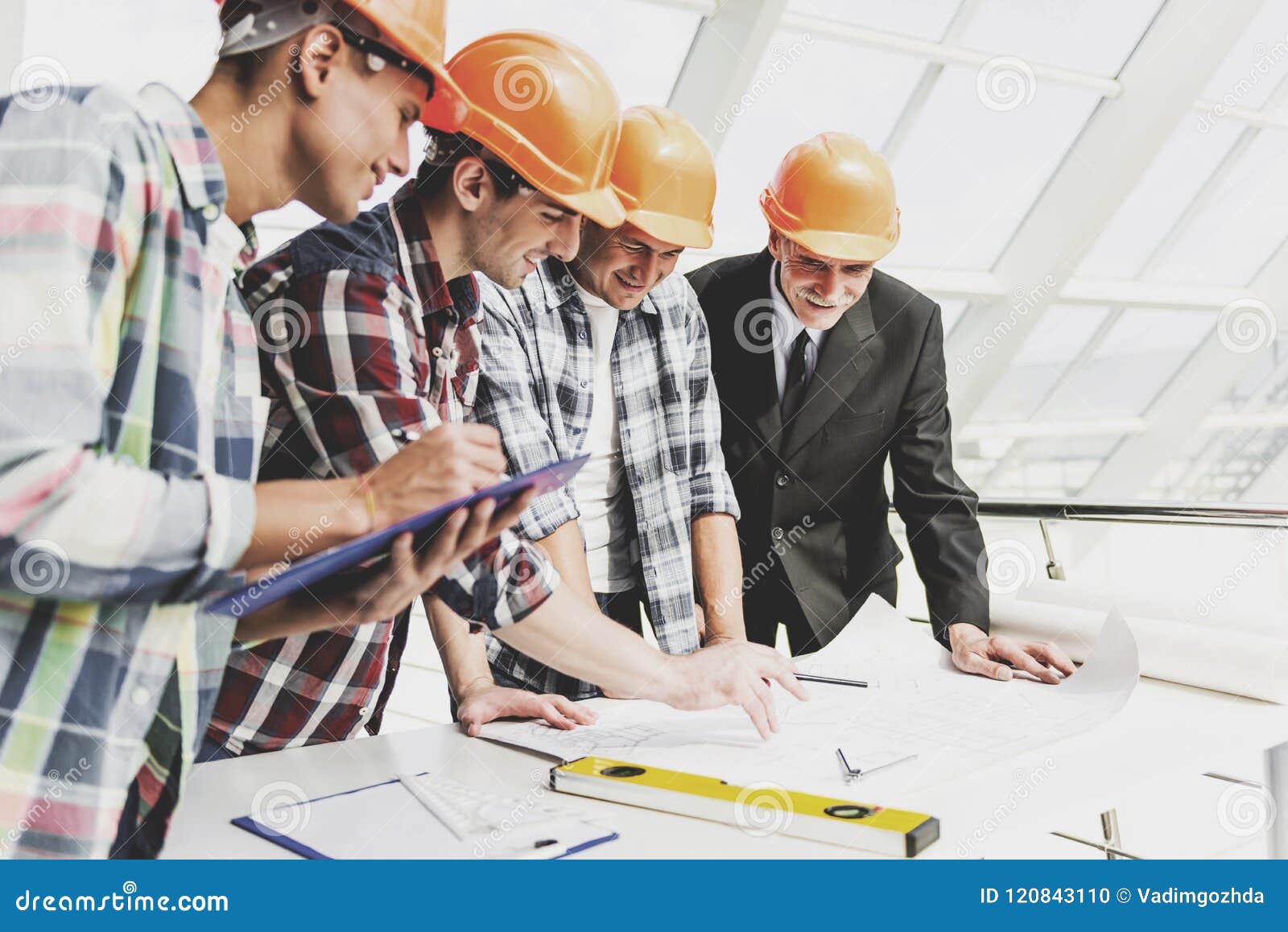 https://thumbs.dreamstime.com/z/men-helmets-works-blueprint-tools-four-drawing-accessories-modern-construction-engineering-concepts-safety-work-120843110.jpg