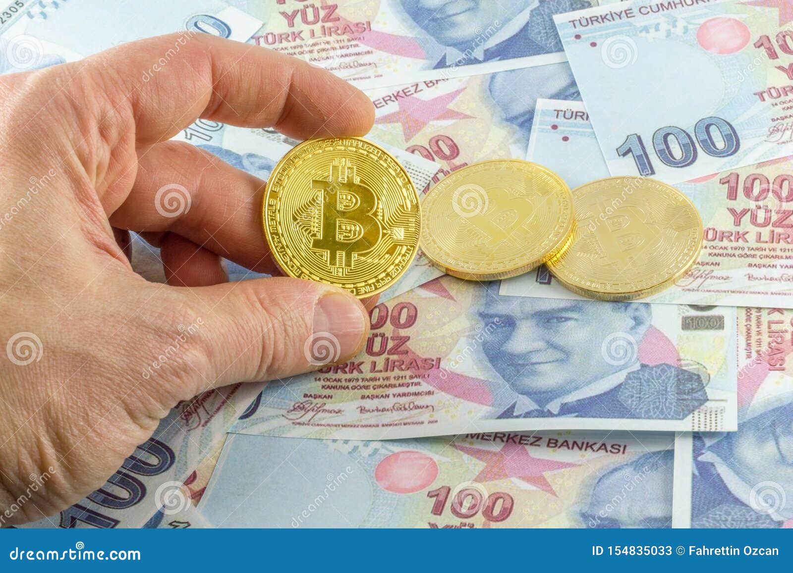 Men Hold Bitcoin Over Turkish Banknotes. Stock Image ...