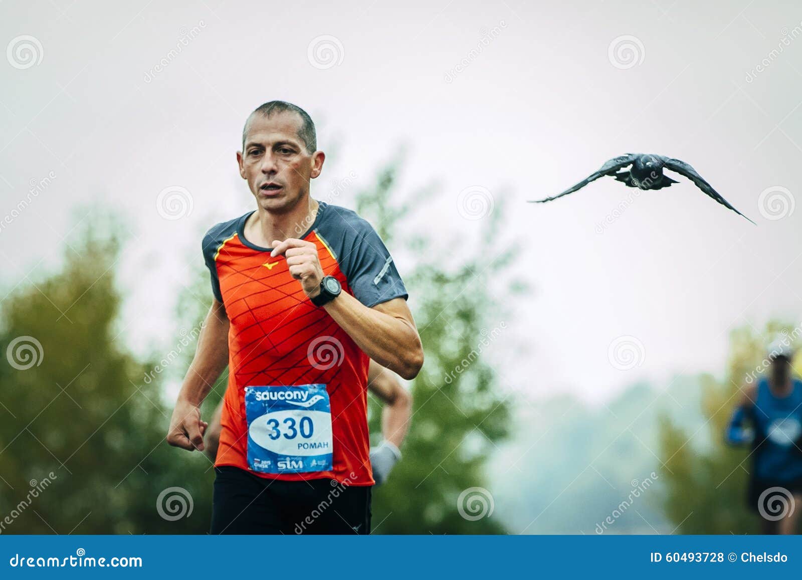 men-middle-aged-runner-running-him-flying-pigeon-omsk-russia-september-man-siberian-international-marathon-60493728.jpg