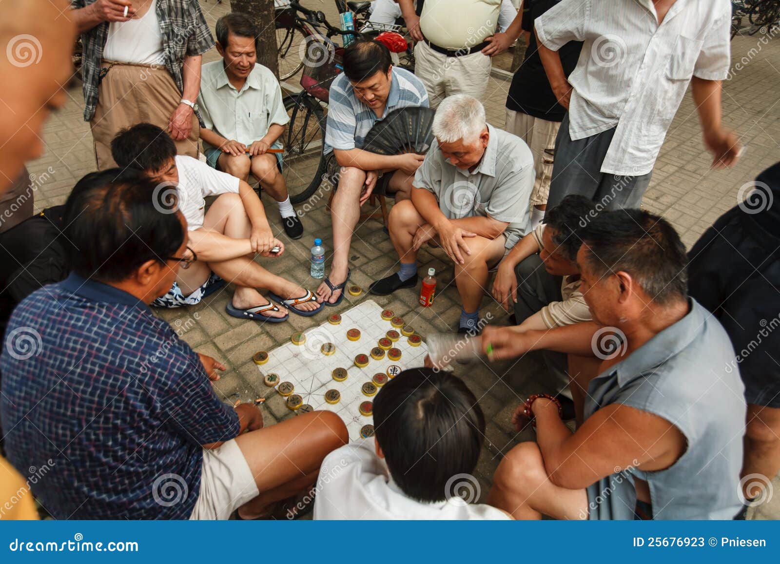 Men Playing Chinese Chess On The Street In Beijing ...