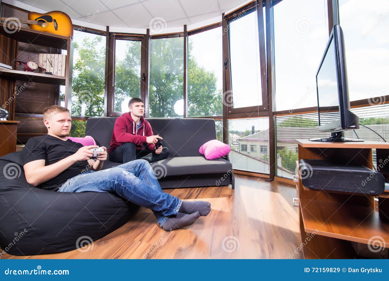 Men Playing Video Games while Sitting on Sofa Stock Image Image of