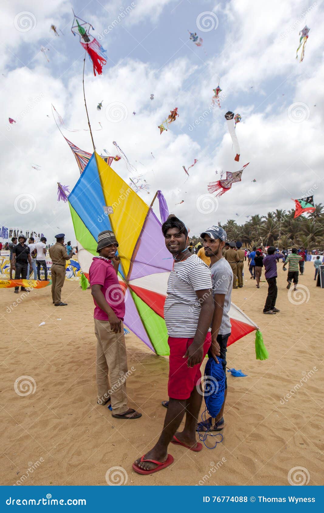 Men Prepare To Launch Their Kite On Negombo Beach In Sri Lanka During ...