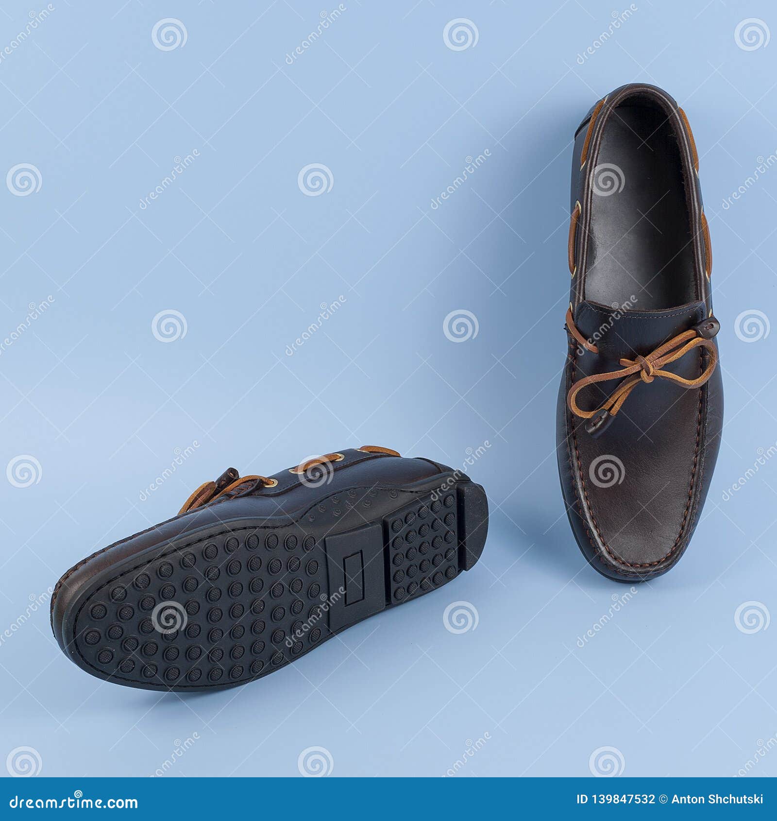 Men`s Brown Suede Moccasins, Loafers Isolated Blue Background Stock ...