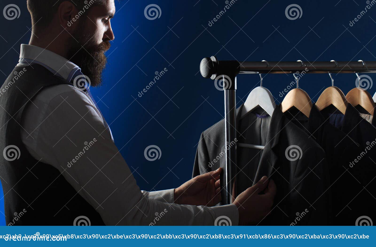 men`s clothing, shopping in boutiques. tailor, tailoring. stylish men`s suit. men`s suit, tailor in his workshop