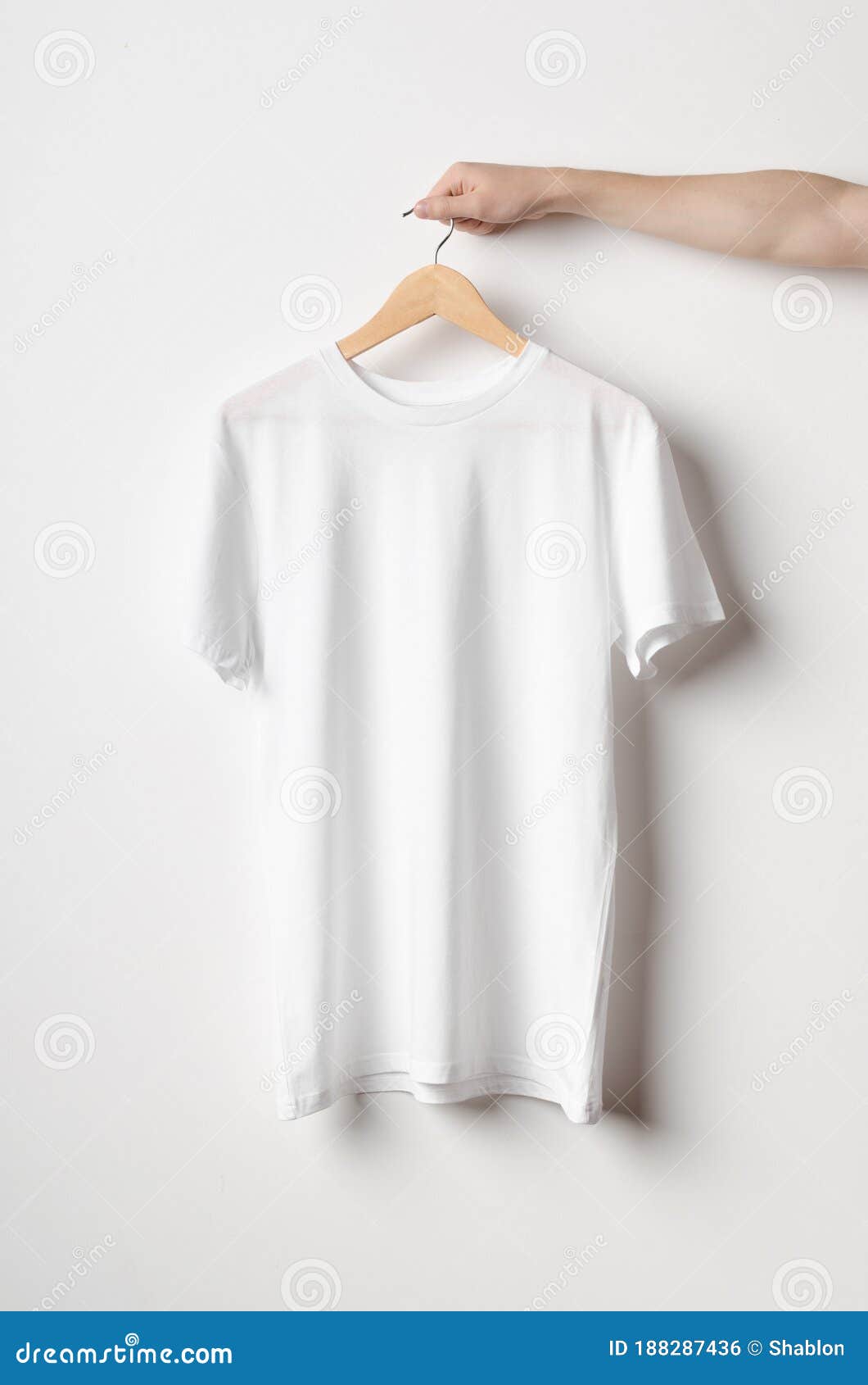 Download Men`s Crew Neck T-Shirt Mock-Up - Man Holding A White T ...