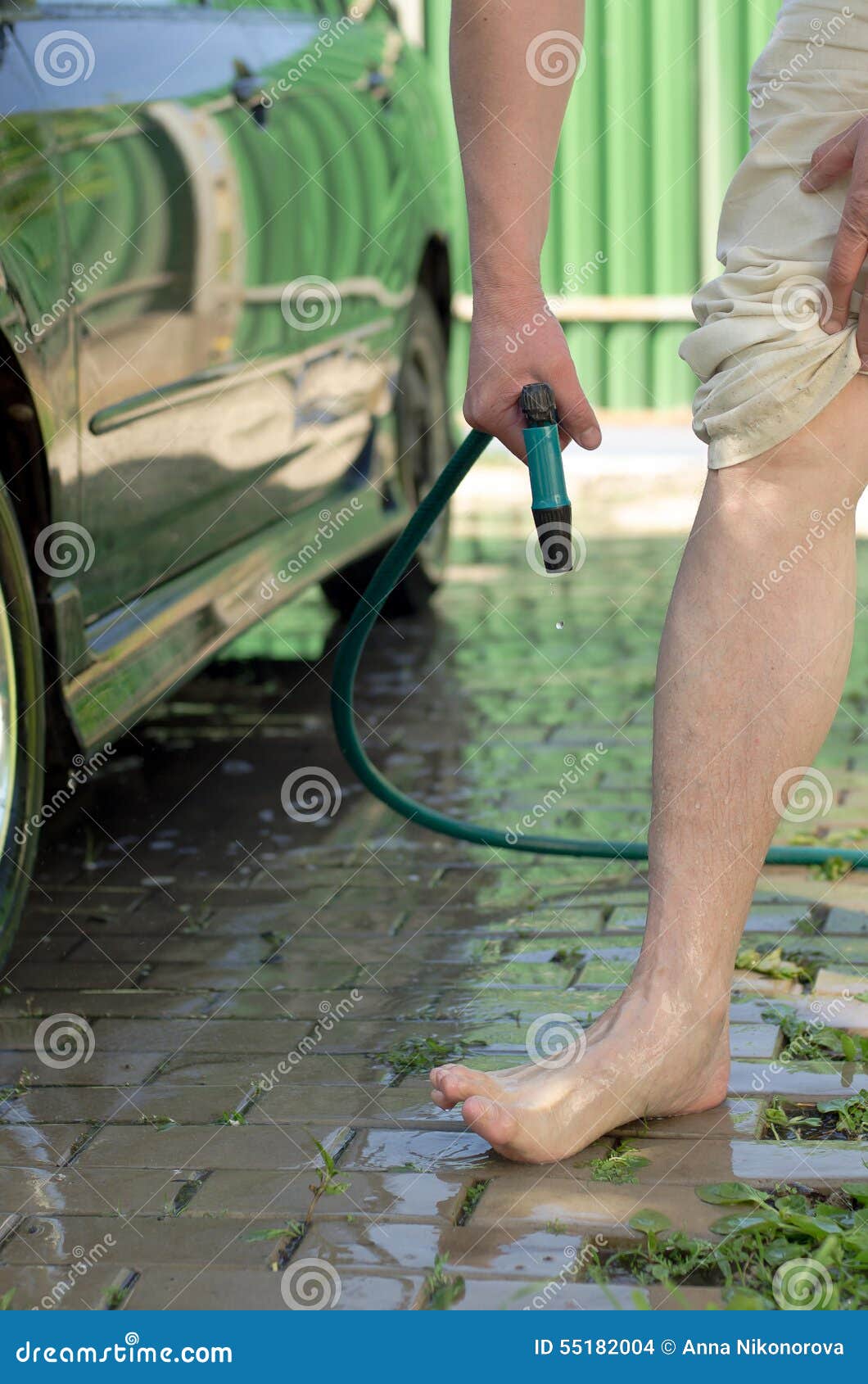Men S Feet are Watered with Water from a Hose Stock Photo Image of