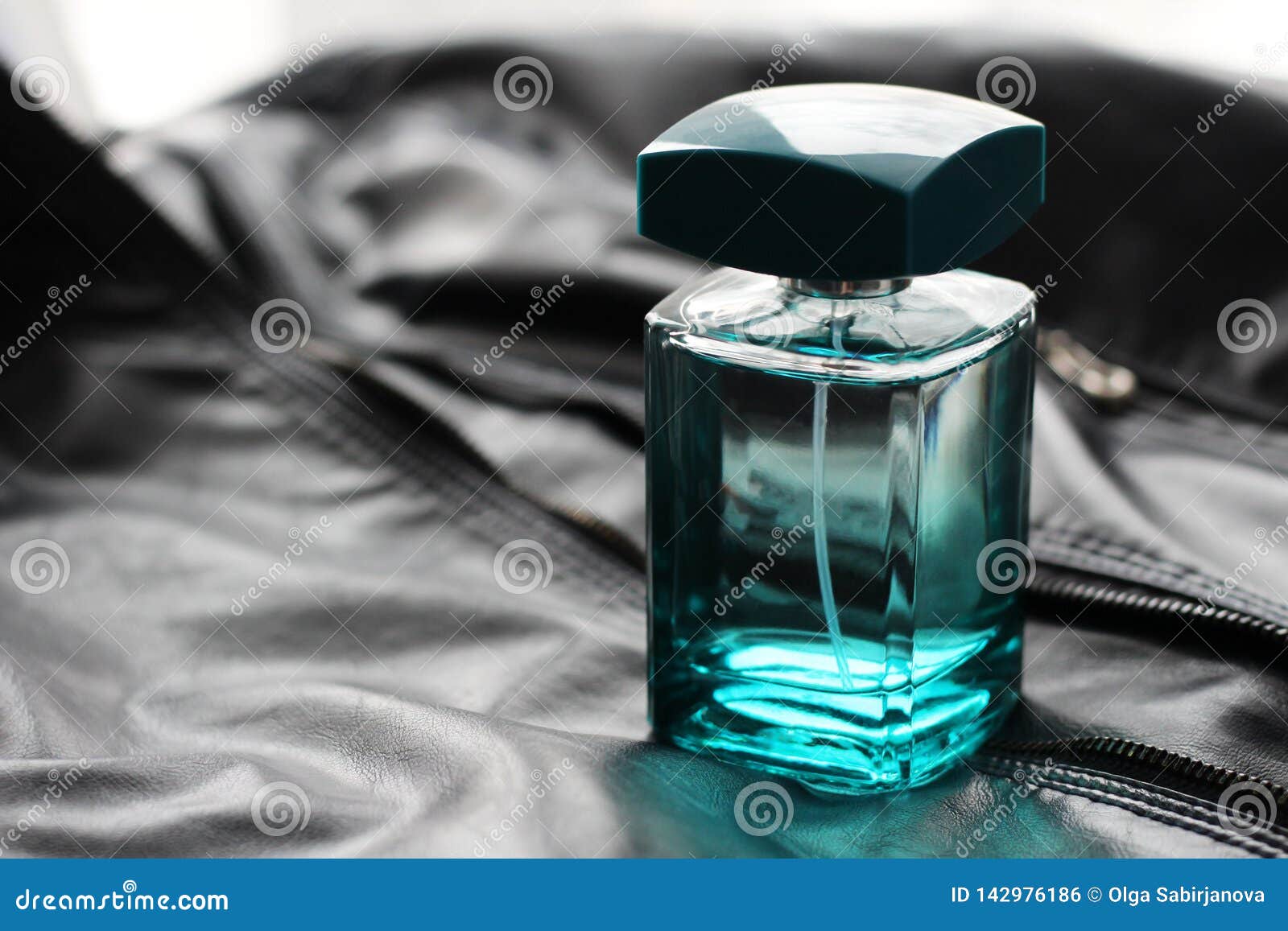 Men`s Green Perfume in Beautiful Bottle on Leather Fabric Stock Photo ...