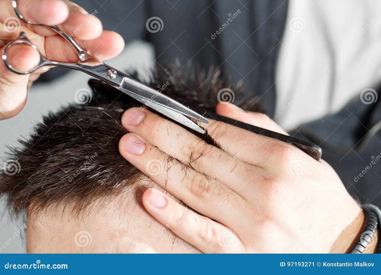 men's haircut with clippers and scissors