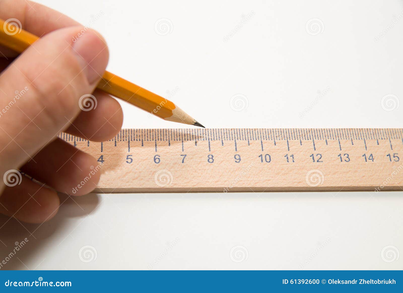 men's left hand holding a pencil on over white