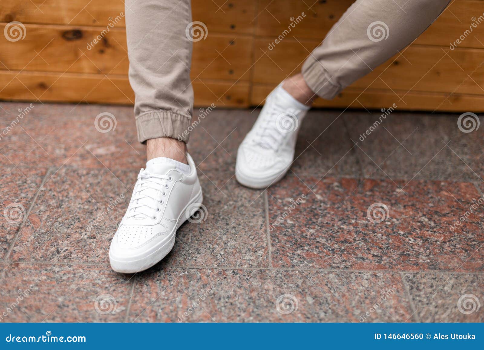 Men`s Legs in Leather Fashion White Sneakers in Stylish Beige Pants. Trendy  Casual Outfit. Details of Everyday Look Stock Photo - Image of city,  people: 146646560