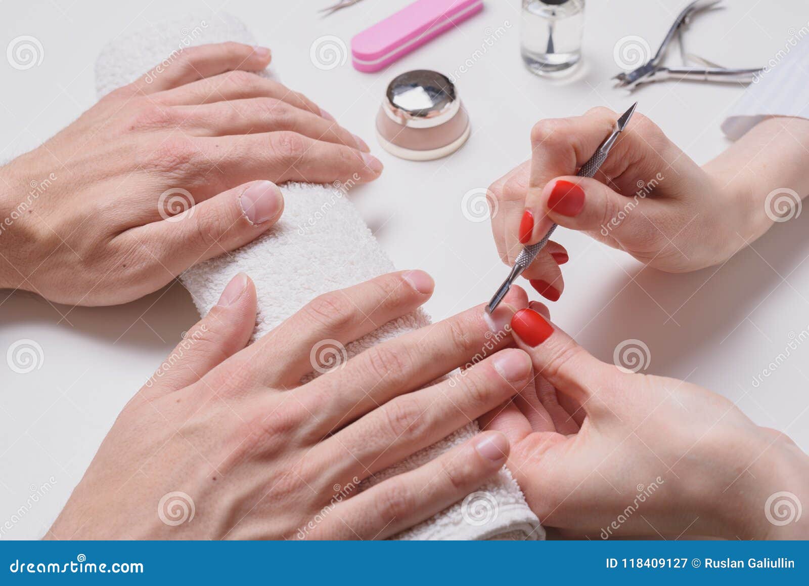 Men`s Manicure. Hands of the Beautician Treated Cuticle of Male Hands ...