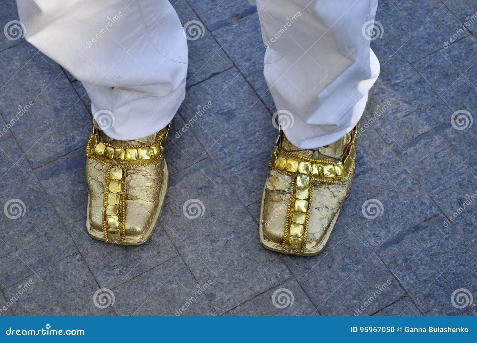 Men`s shoes in gold color stock photo. Image of square 95967050