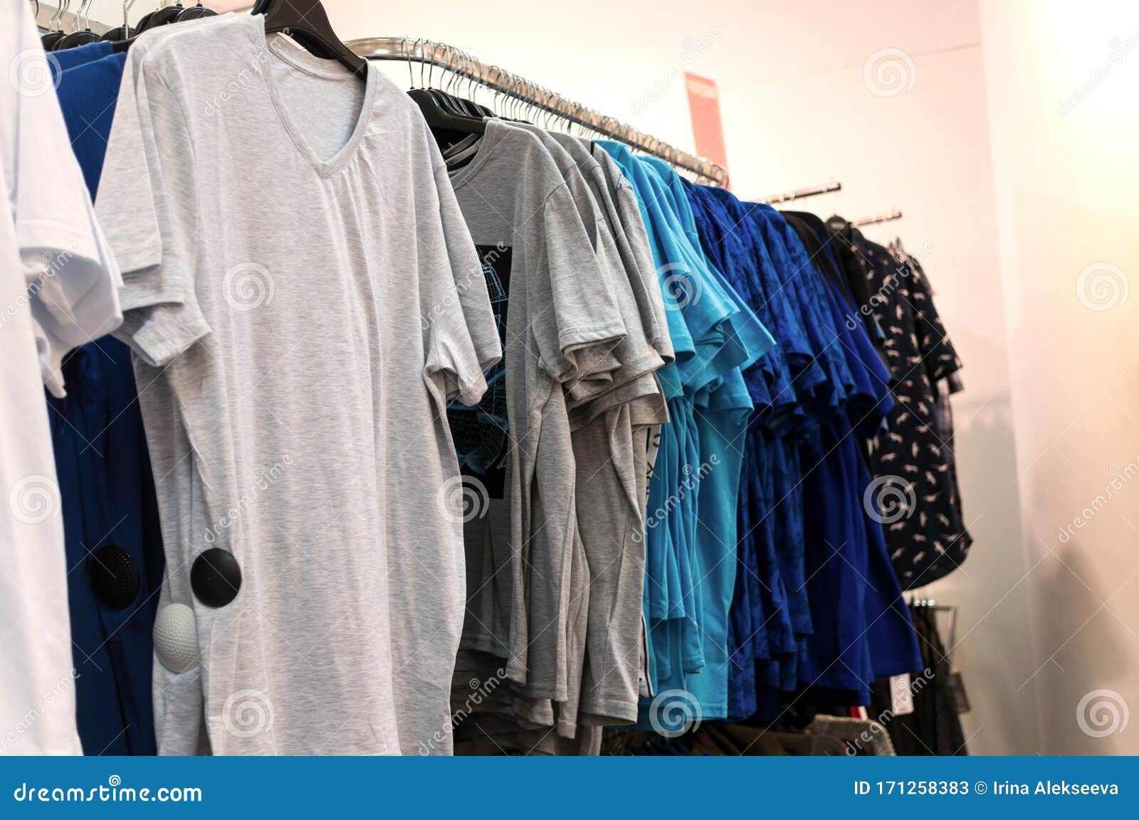 Men`s T-shirts on Hangers in a Clothing Store Stock Image - Image of ...