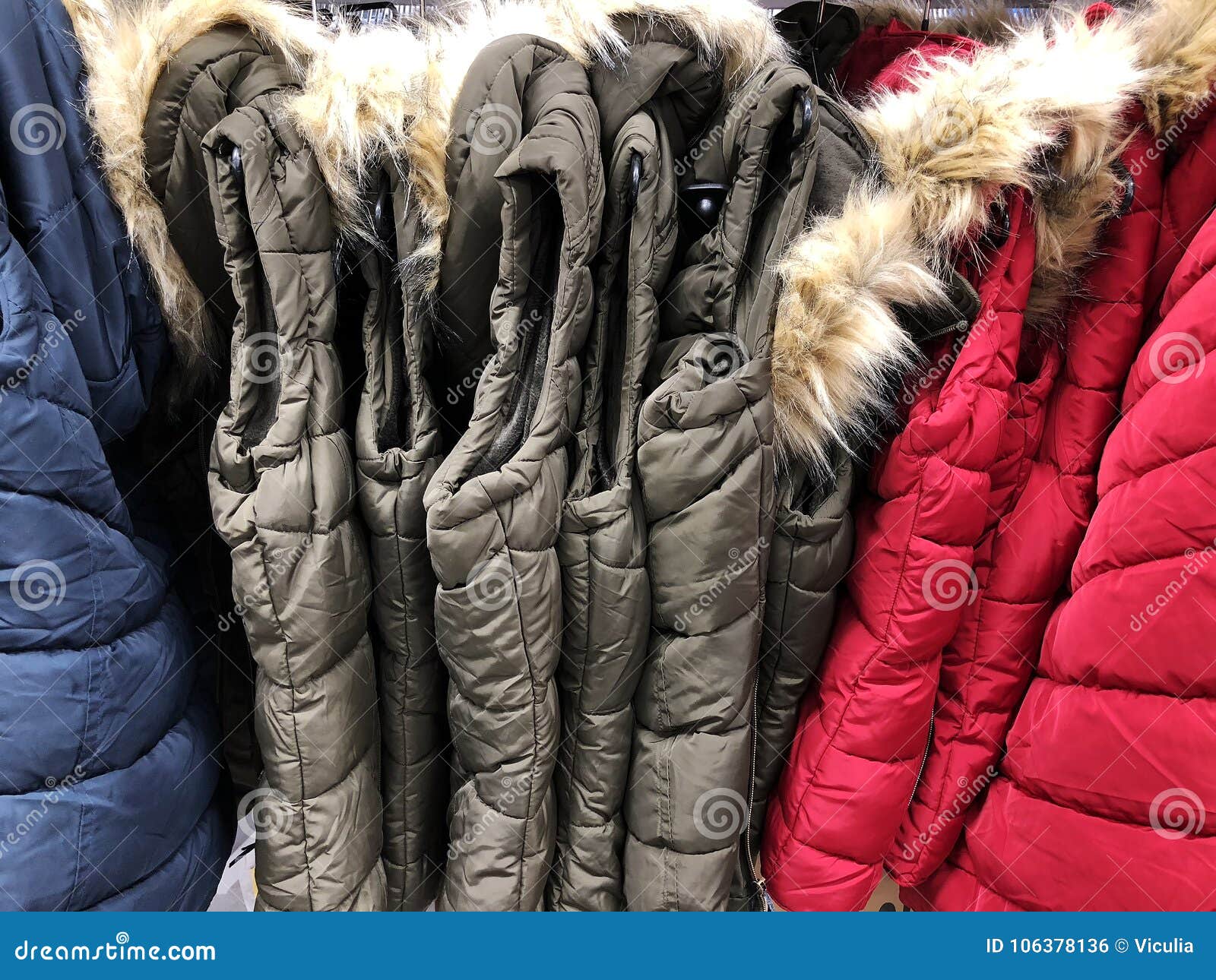 Men`s and Women`s Down Jackets on the Counter in the Store Stock Photo ...