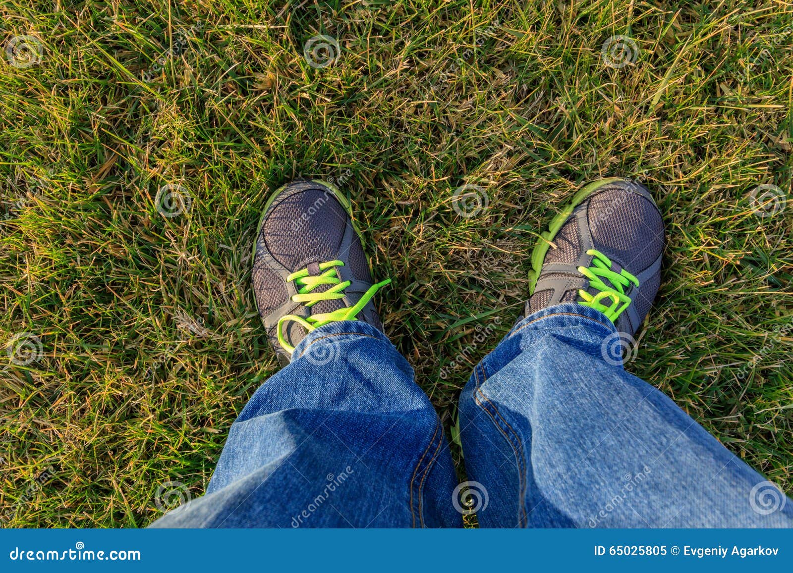 Men Standing on the Grass in Jeans and Sneakers Stock Image - Image of ...