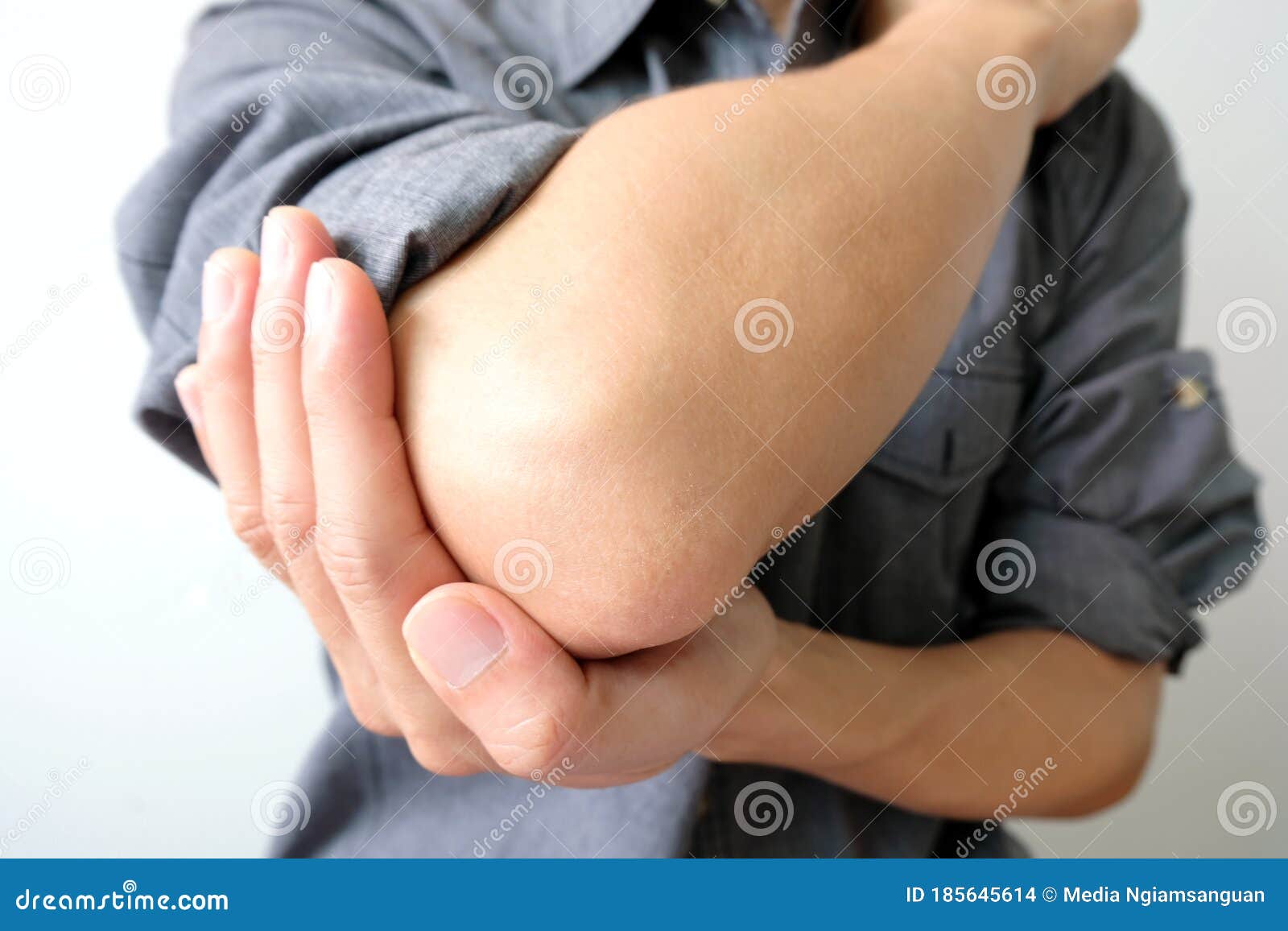 Men Use Their Hands To Hold Their Elbows and he Had Pain at the Elbows