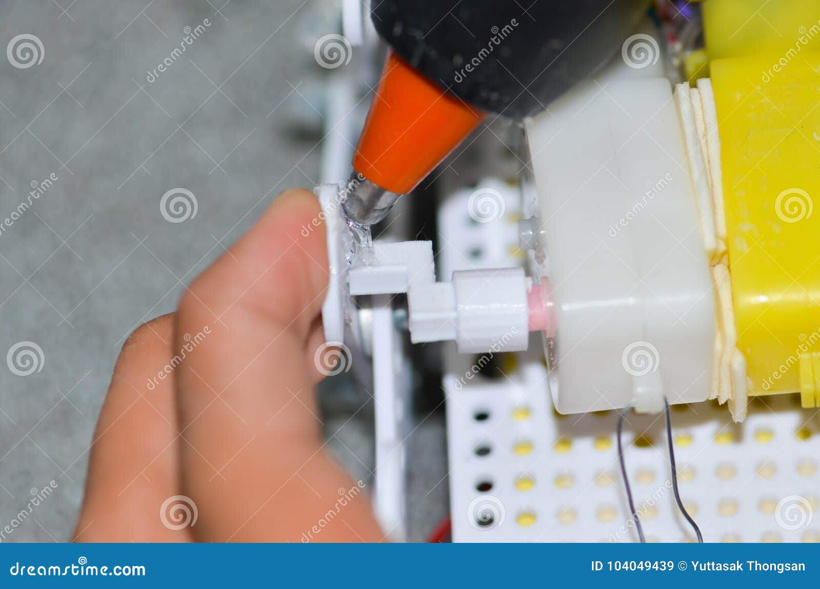 Men are Using Hot Glue To the Device. Stock Image Image of glue