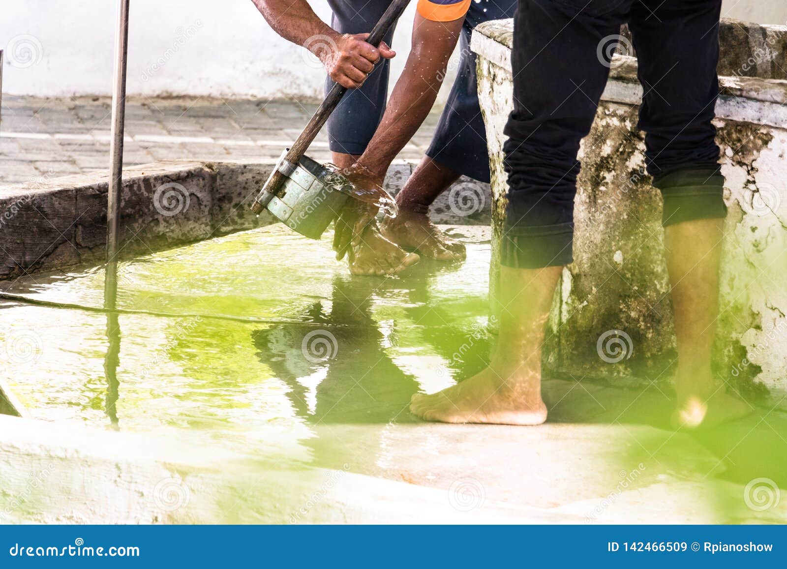 men washing their feet making ablution on a fount in a mosque in male,  maldives