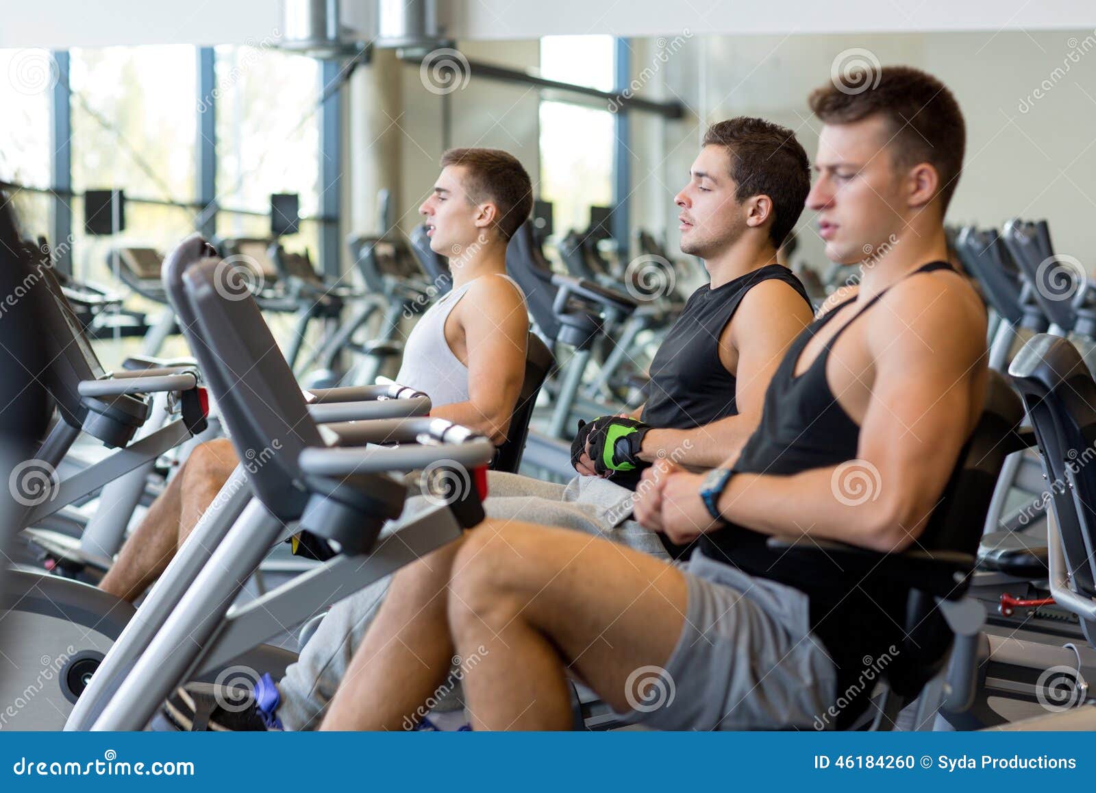 Men Working Out on Exercise Bike in Gym Stock Photo - Image of health,  male: 46184260