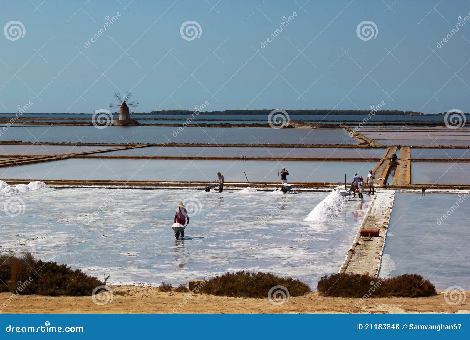 men working on the saltpans in mozia in sicily