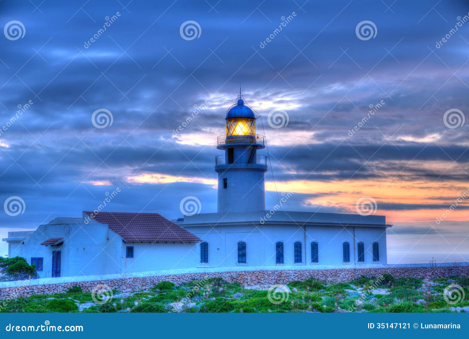 menorca sunset at faro de caballeria lighthouse