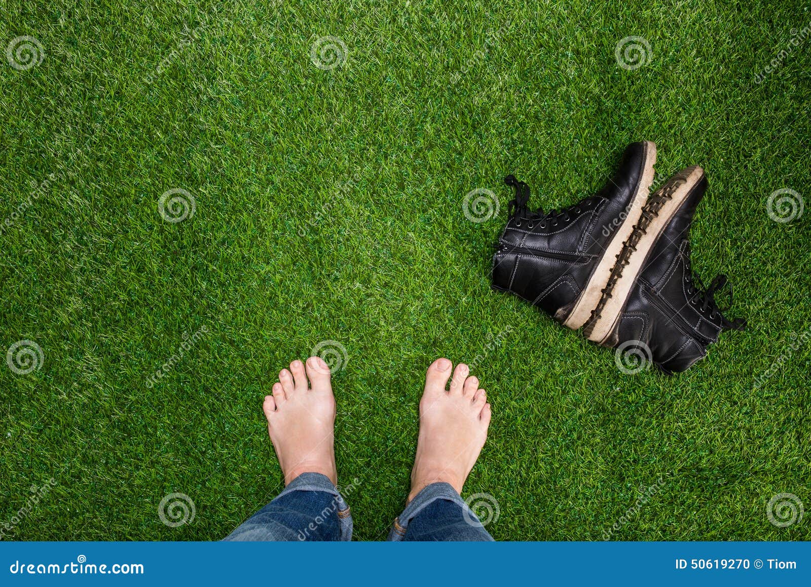 Mens Feet Resting on Grass with Lying Boots Stock Photo Image of copy