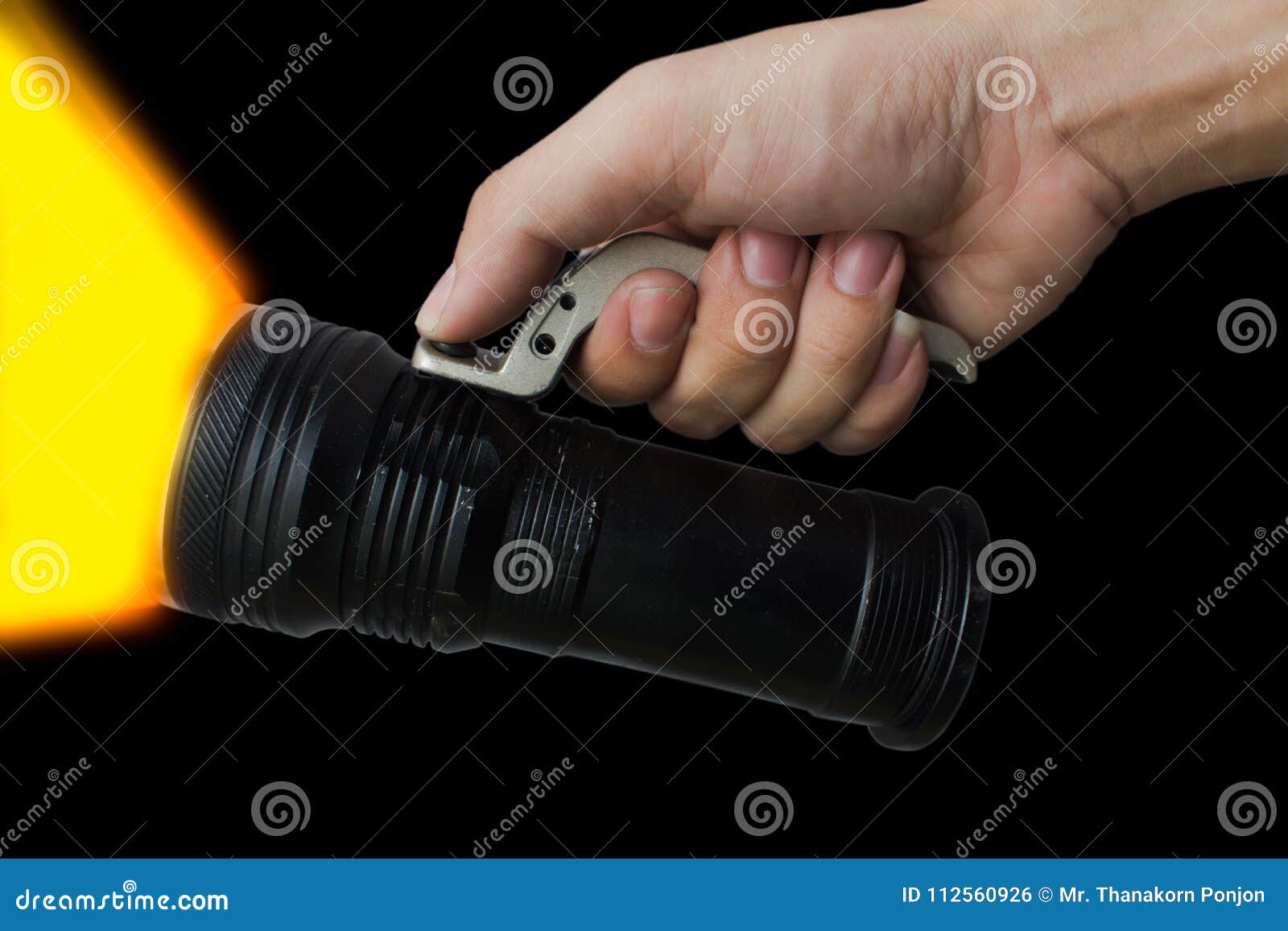 Mens Hand Holding a Flashlight on Background. Stock Photo Image of