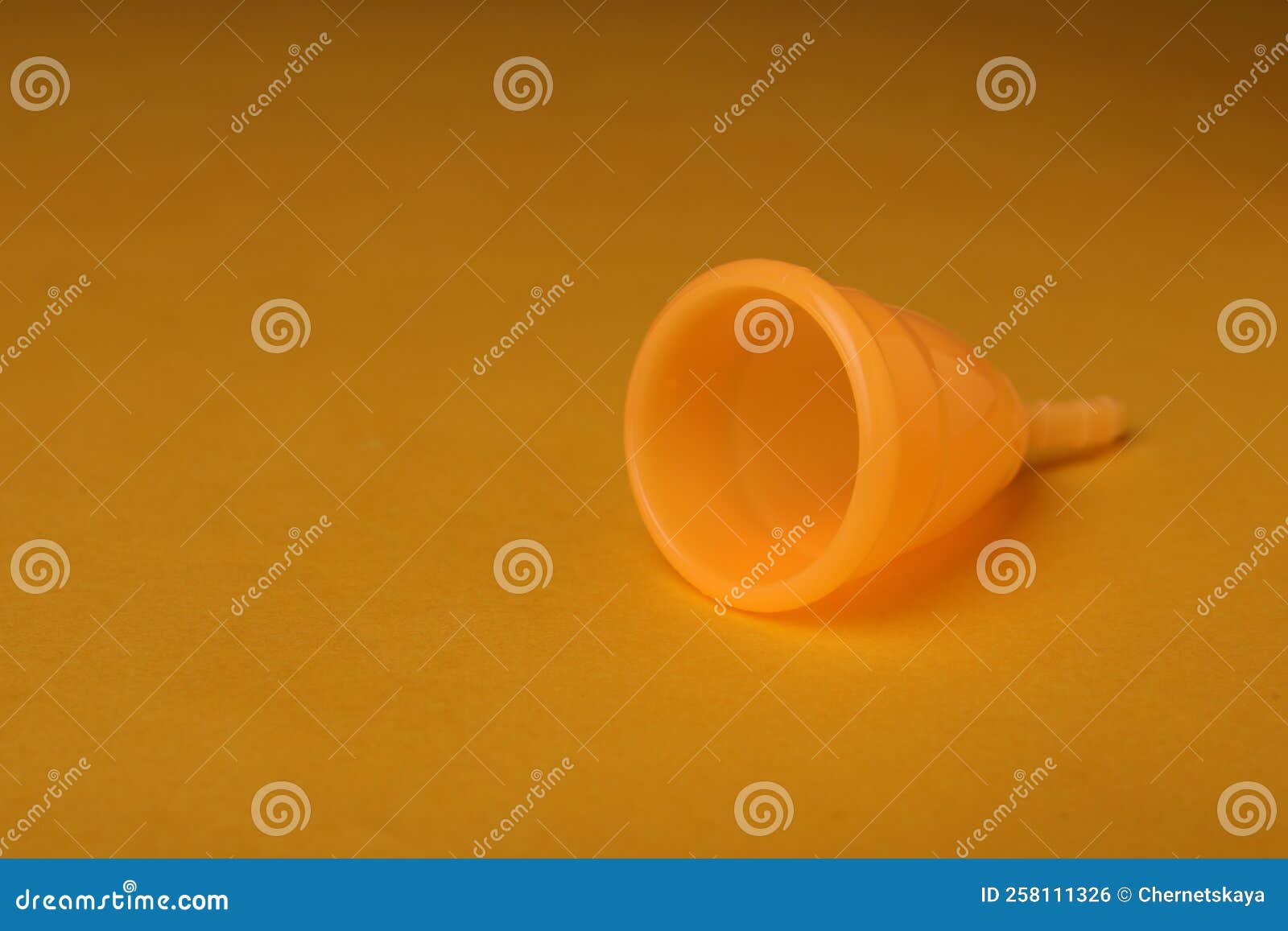 Menstrual Cup on Yellow Background. Space for Text Stock Photo Image