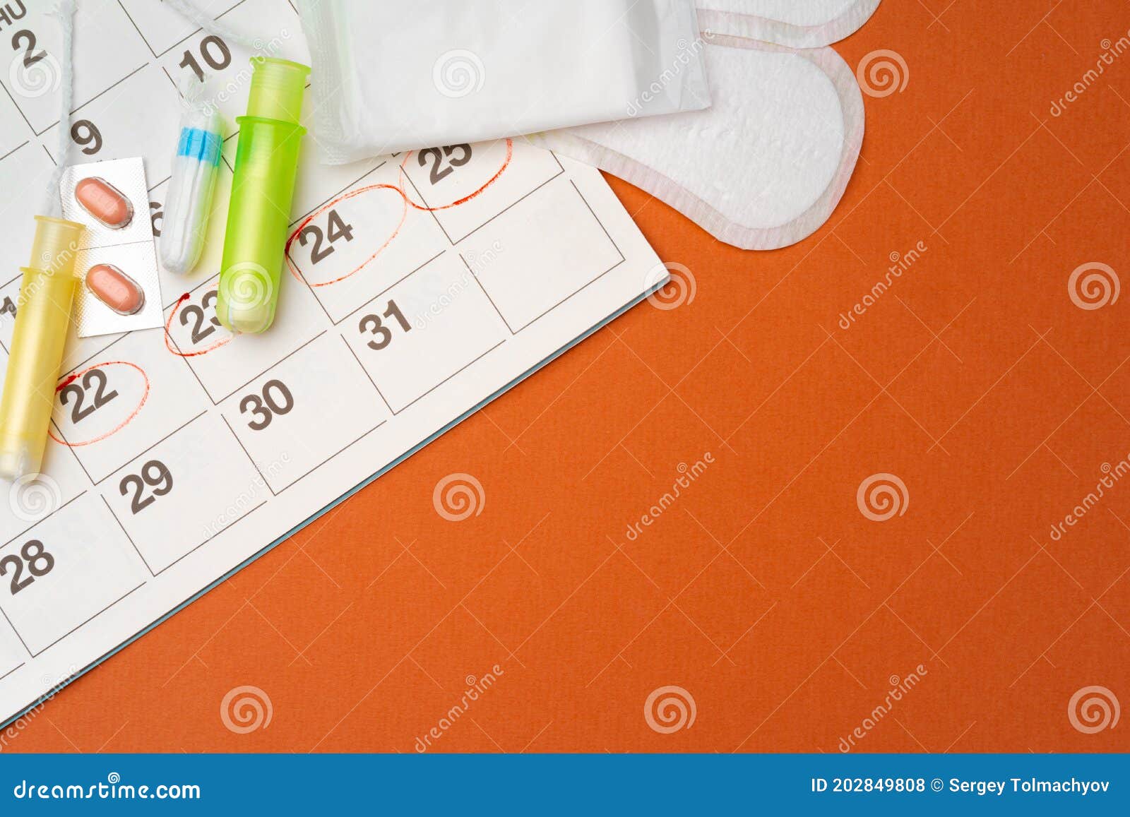 Menstruation Calendar with Sanitary Pads and Tampons, Pills Stock Photo