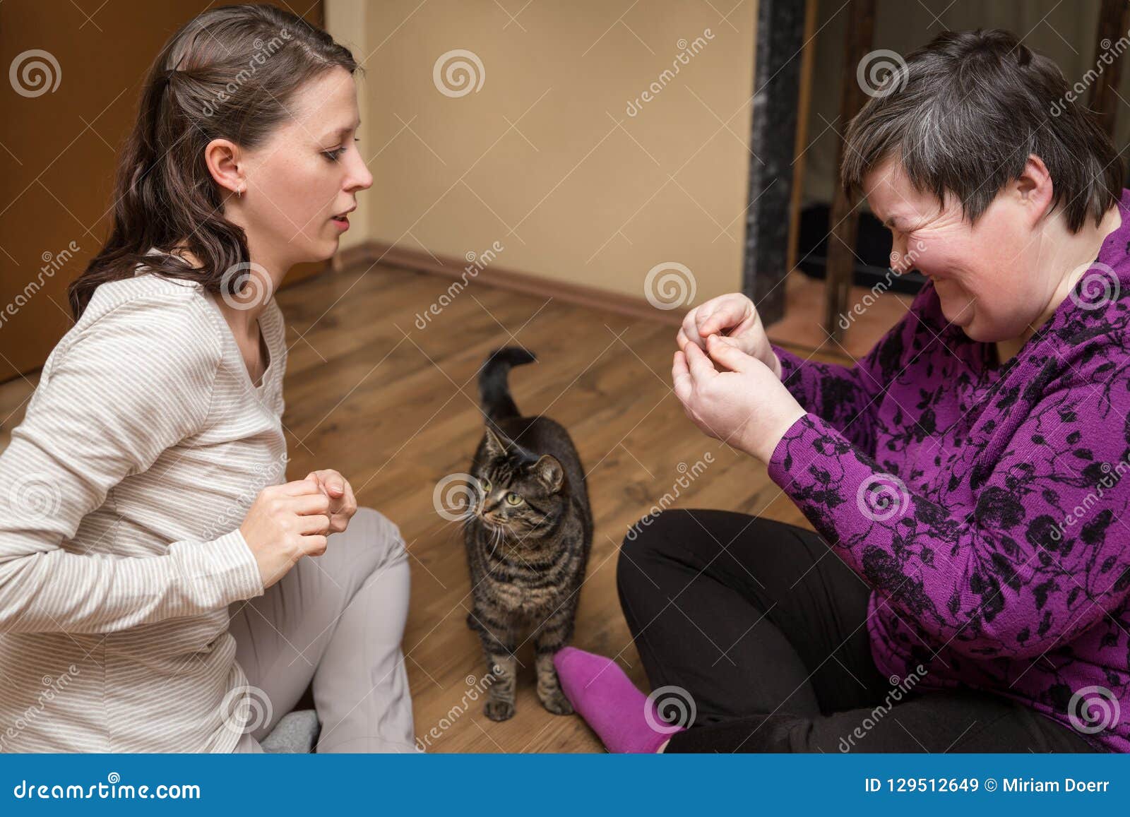 mentally disables woman and nurse with a cat, animal assisted