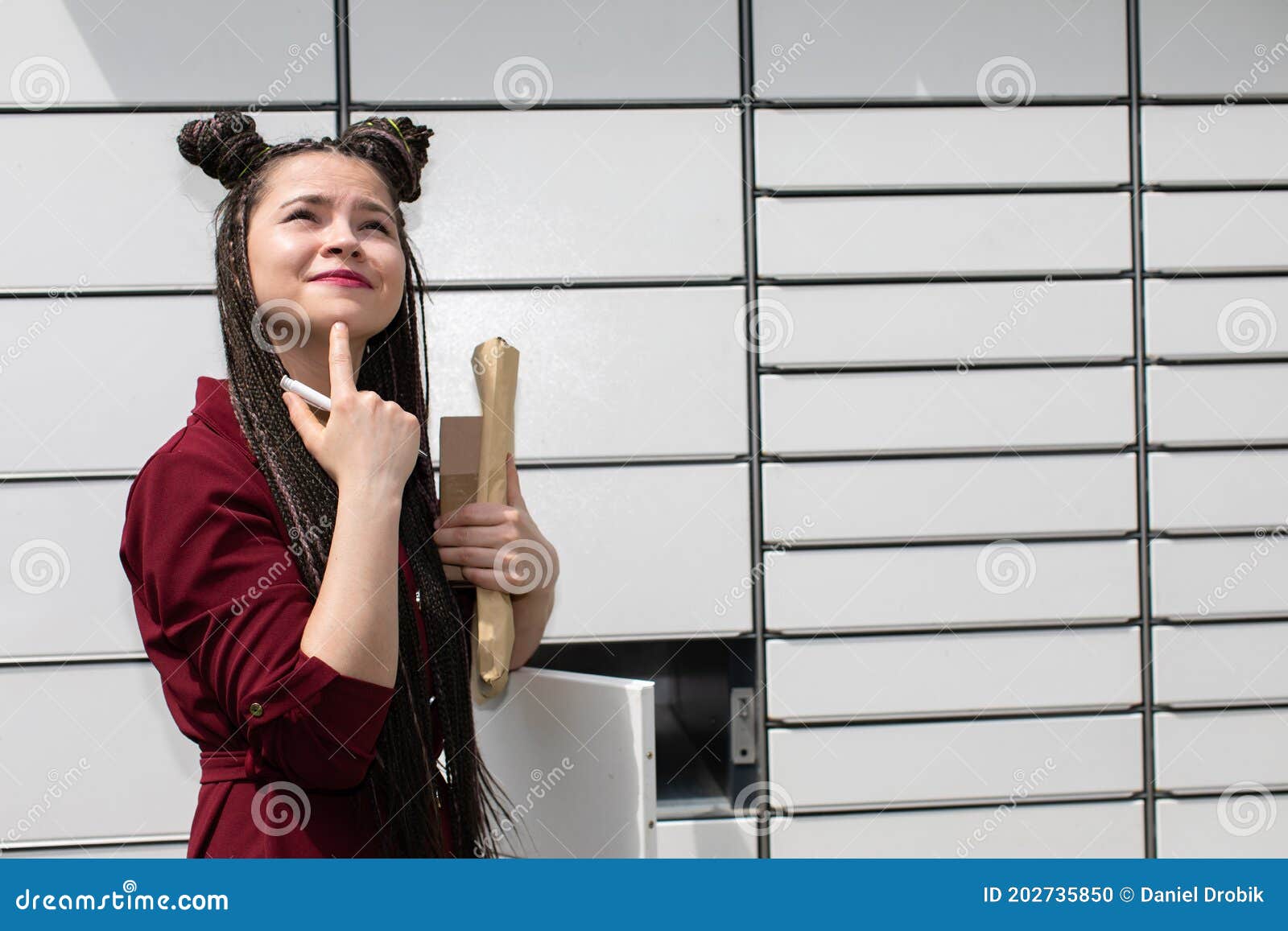 The Teenager Wonders Who Could Send Her Such a Gift. she Tries To Guess from Whom she Received the Mail. Photo - Image of african, parcel: 202735850